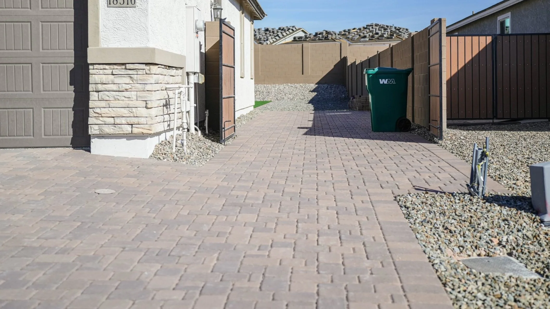 New build construction home paver driveway installation in Queen Creek by Better Life Landscape & Design
