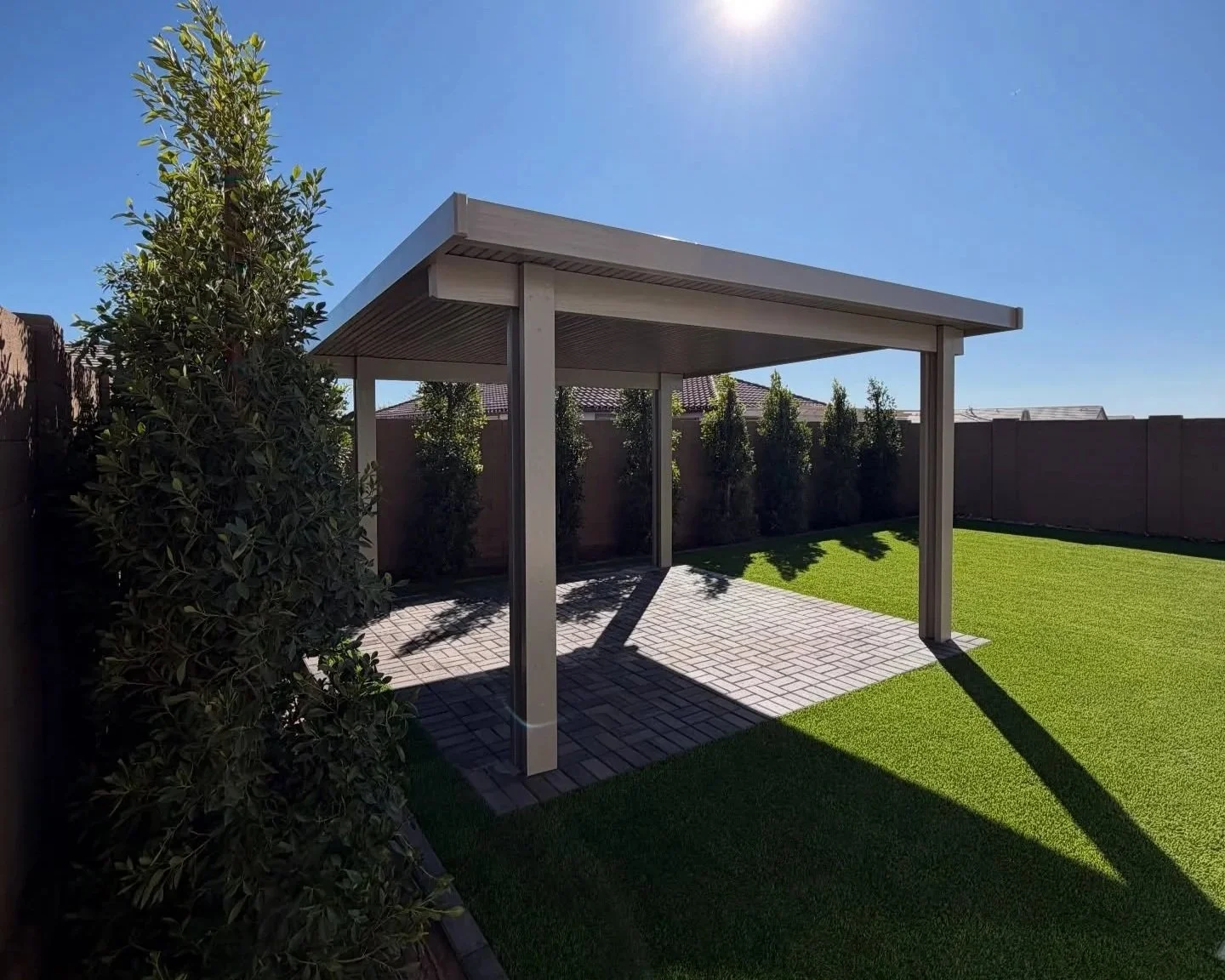 Pergola installation at this new build construction home along with tree planting, turf and pavers by Better Life Landscape & Design near Apache Junction, AZ