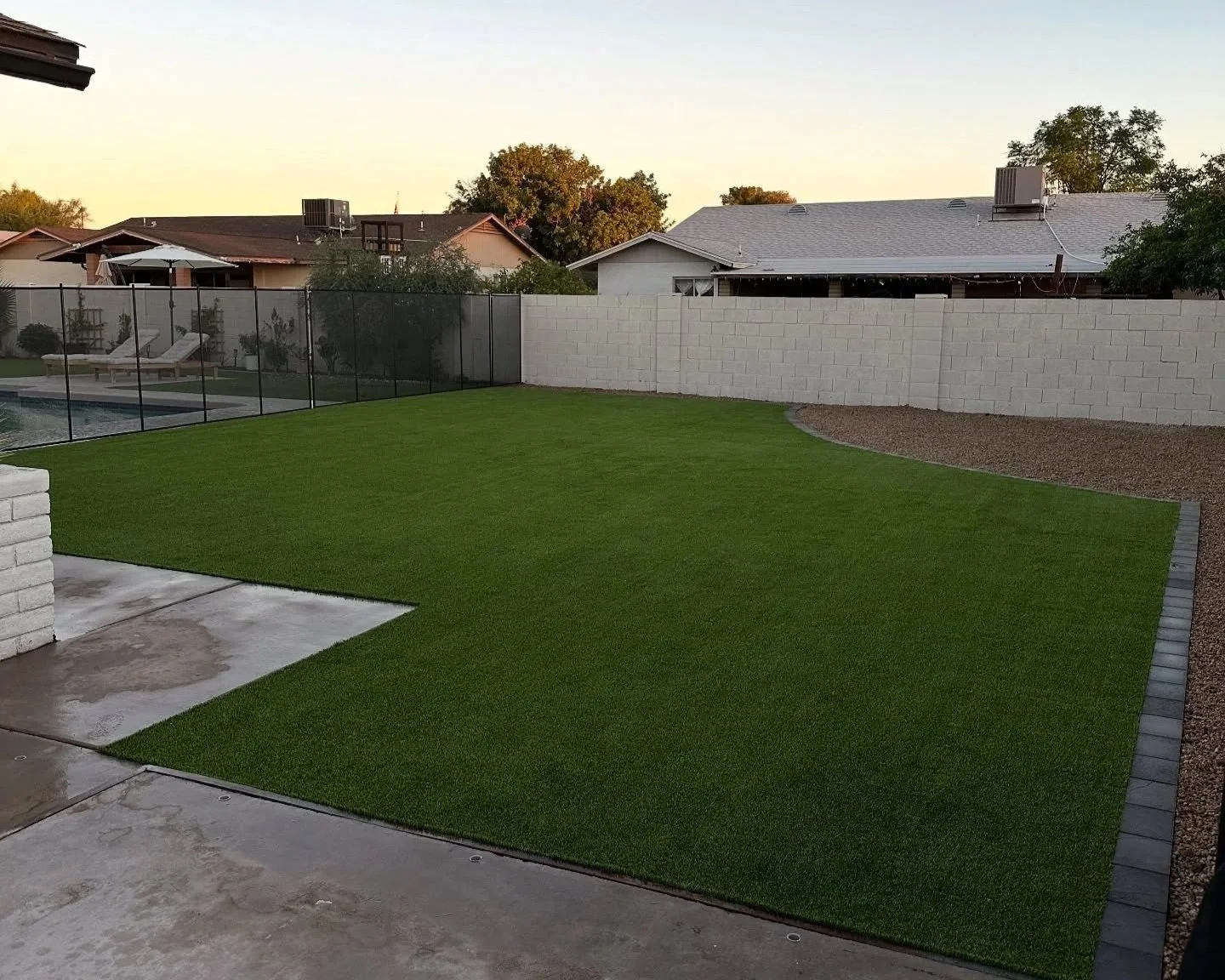 Turf, rock and paver border installation project by Better Life Landscape & Design near Phoenix