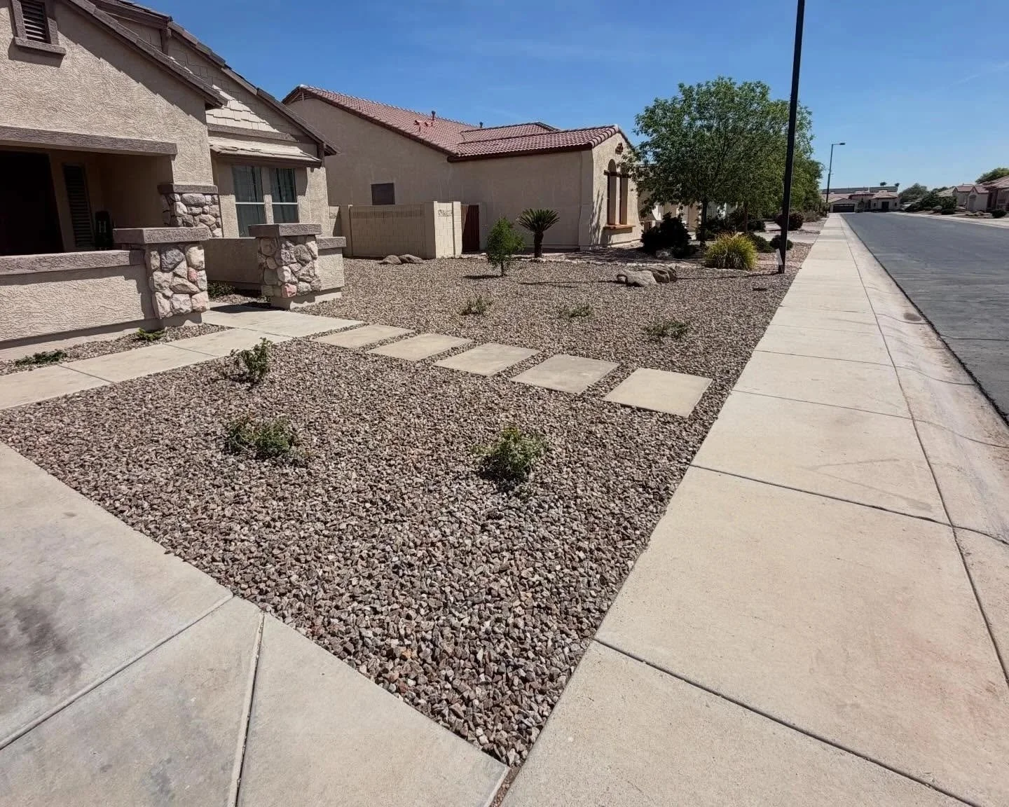 Front yard rock installation by Better Life Landscape and Design at this property in Goodyear