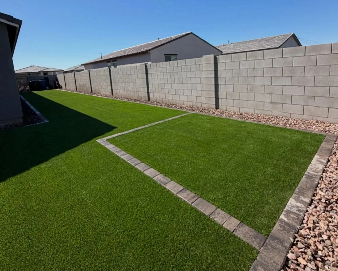 Turf, Paver Border and Rocks installed at this Eastmark Mesa backyard by Better Life Landscape and Design