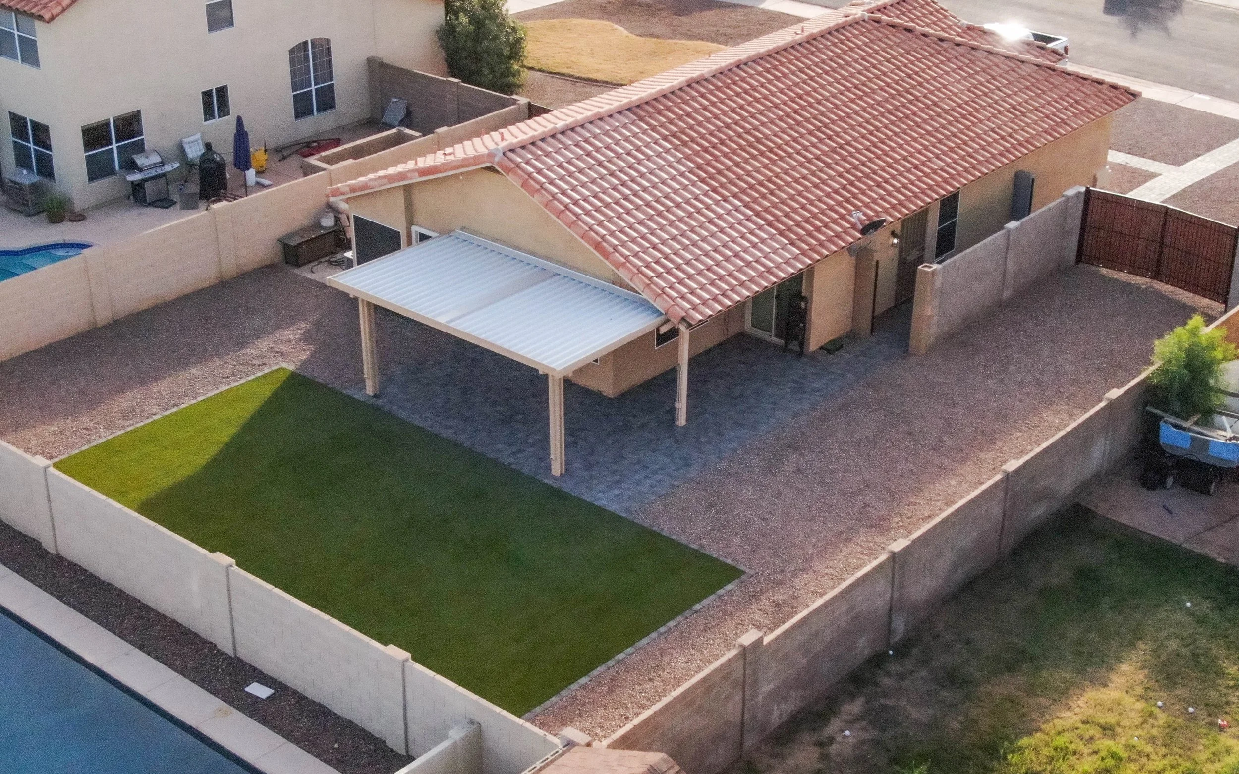 This backyard included demolition the existing landscape and installing new pavers and turf by Better Life Landscape and Design near San Tan Valley.