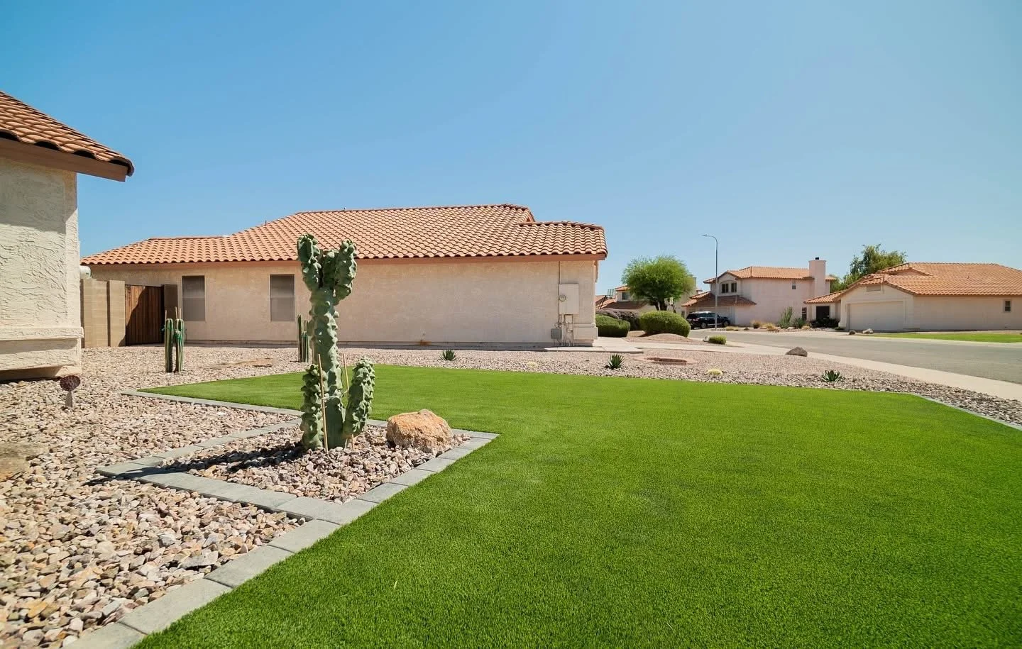 Front Yard Upgrade with turf, tree planting, rocks and a paver border near North Scottsdale, AZ by Better Life Landscape and Design
