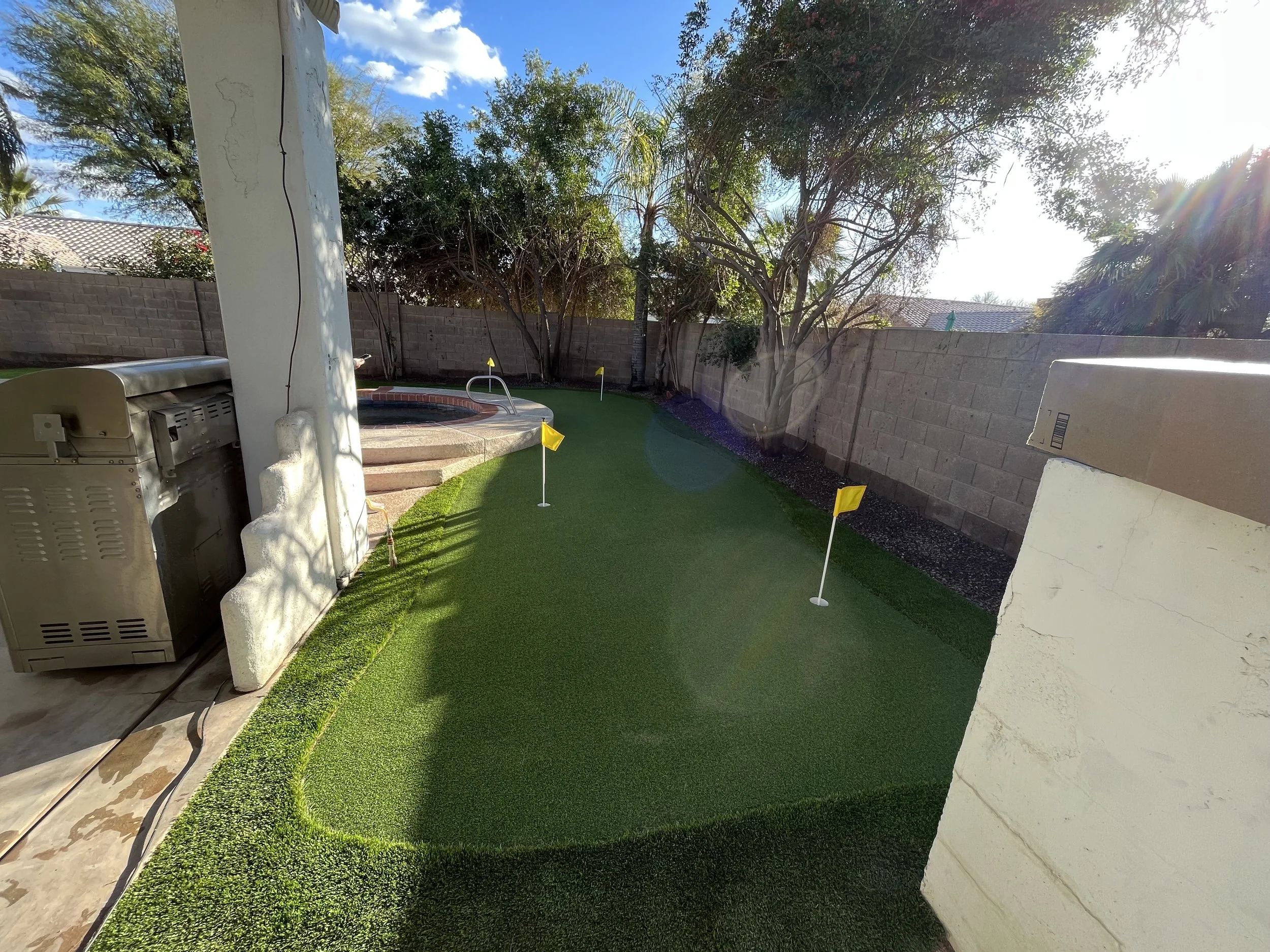 Turf putting green installation at a residential backyard.jpeg