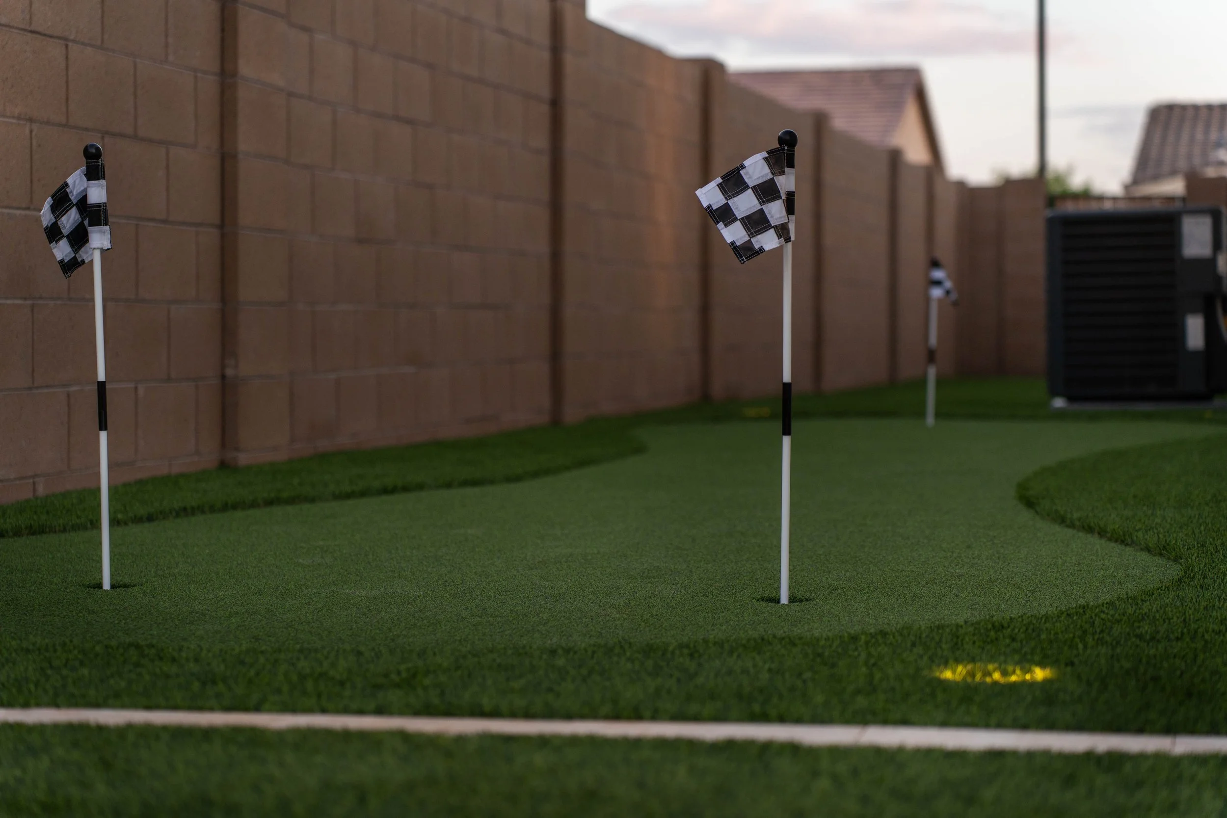 This residential backyard included a turf putting green installation near Phoenix.