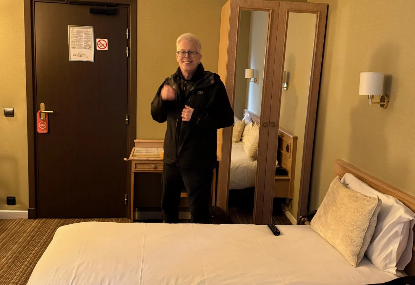 07 - Rick, inside our modest, but comfy and quiet, room. It felt great to call it a day and get out of the cold and rain.