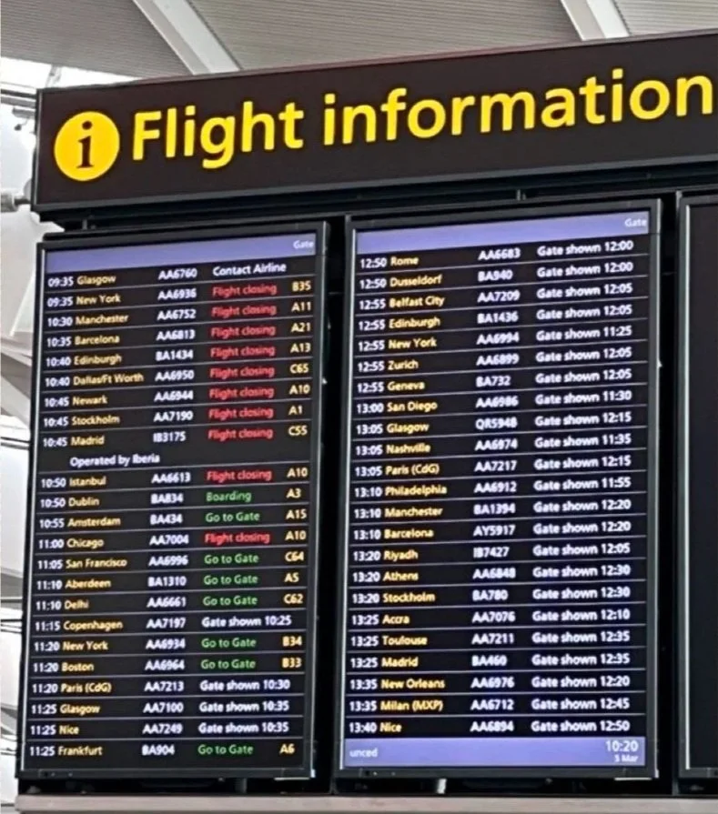 2. Waiting impatiently for London Heathrow to announce the gate for our Paris flight. 