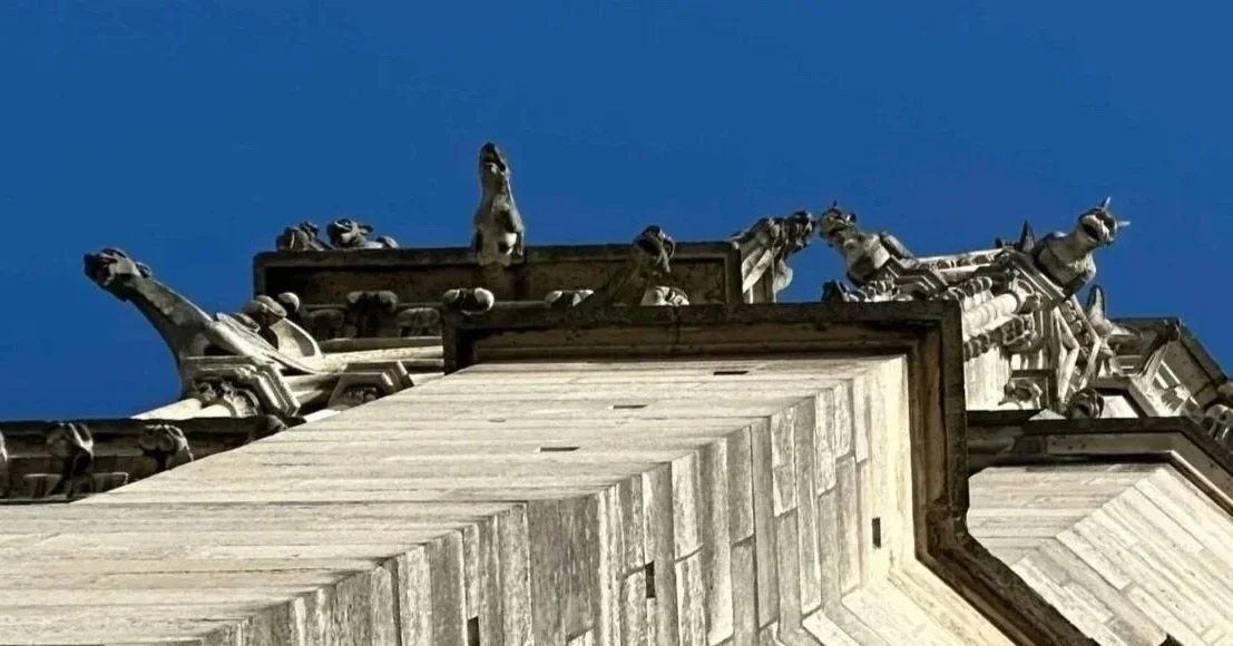 25 - While waiting outside for our bell tower climb, we had a chance to look closer at some of the cathedral's gargoyles. The creepy little guys serve a dual purpose -- first, they act as water drainage systems to prevent rainwater from eroding the s