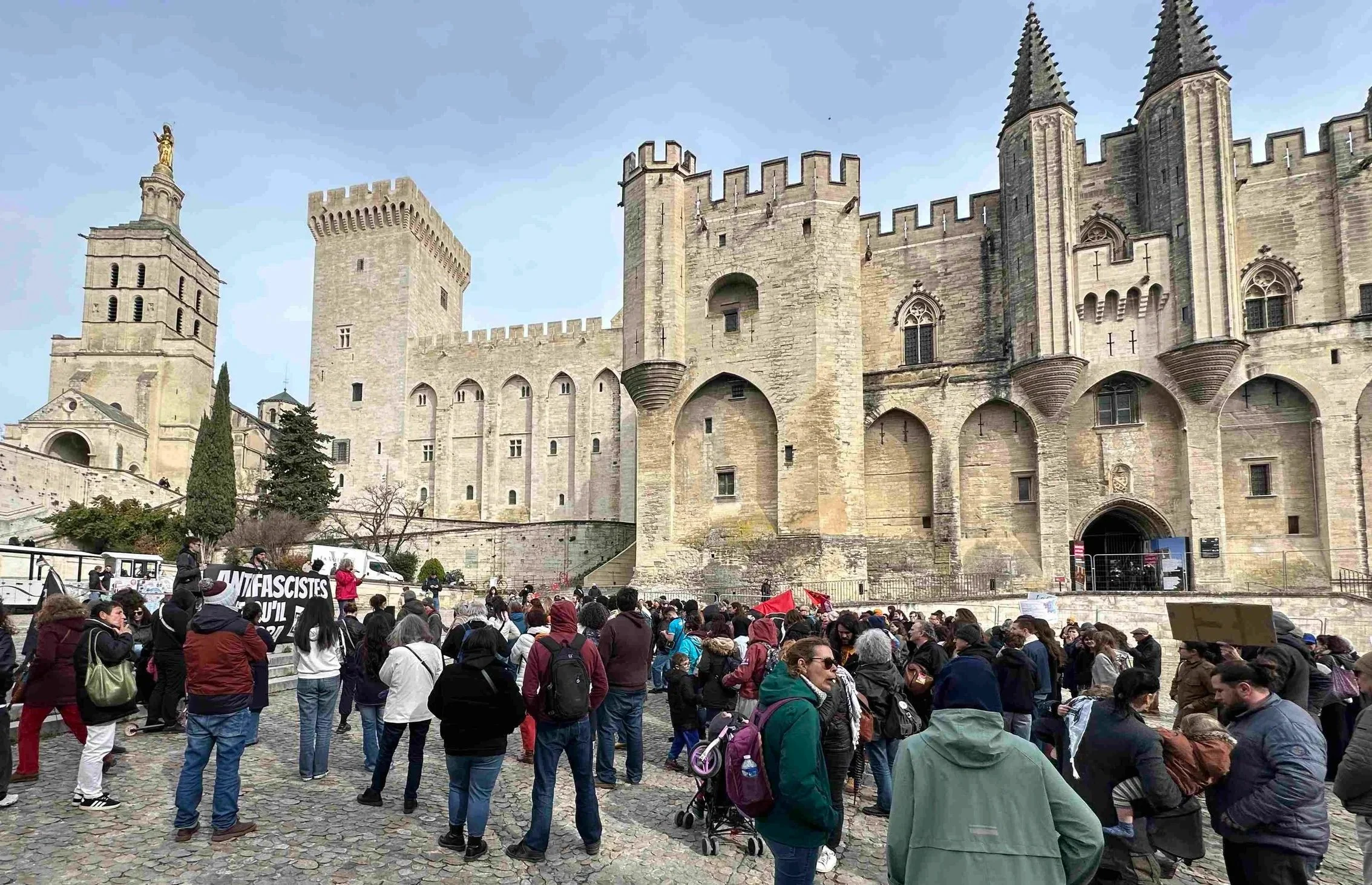 56 - On our visit to the Palace of the Popes, we encountered a protest against fascism.  Fascism is dictatorships, extreme nationalism, and racism.  Some famous  fascists? Hitler and Mussolini.  Any idea why some US leaders don't like anti-fascism an