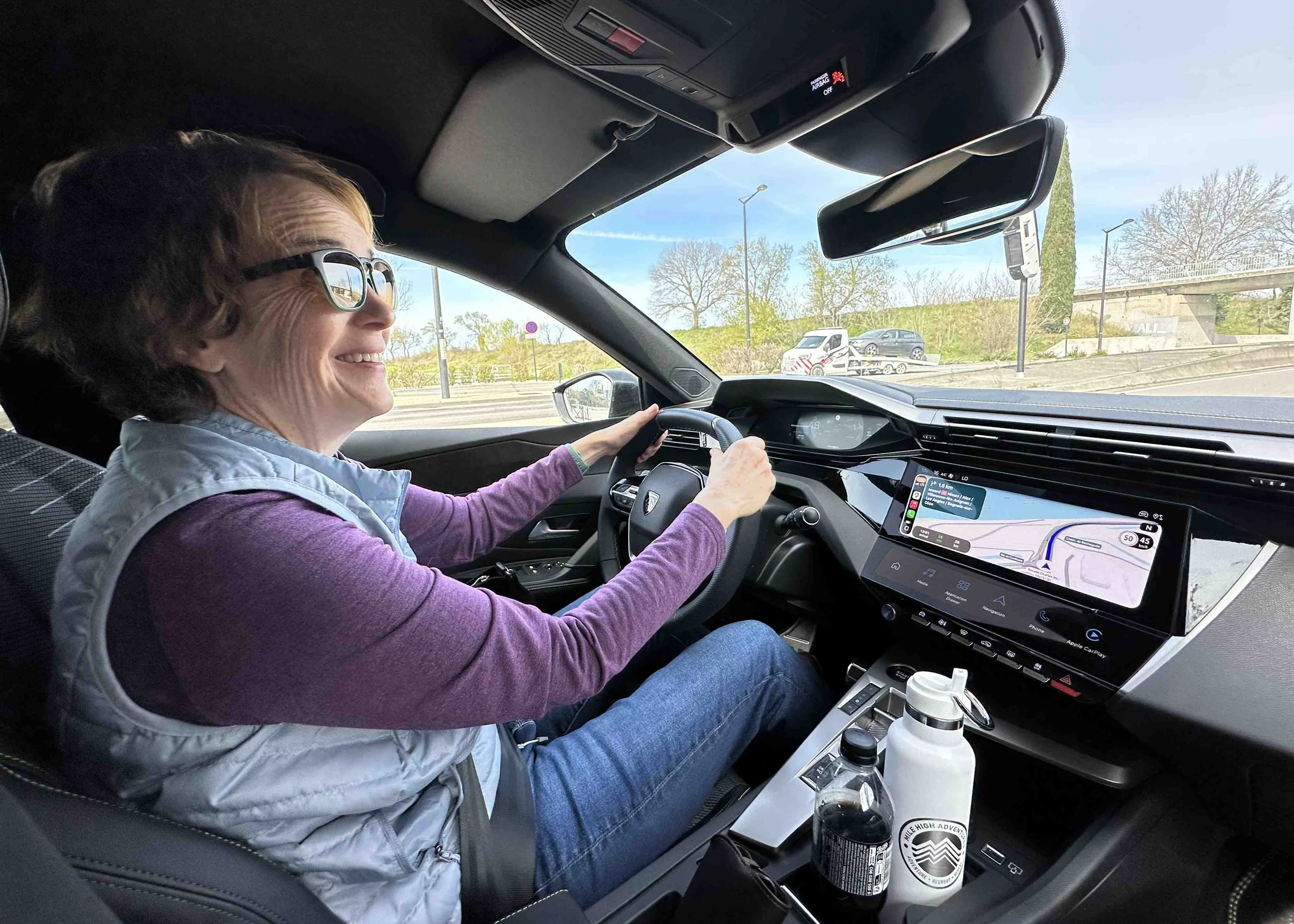 63 - Julie's eager to hit the road in our Peugeot 308.  