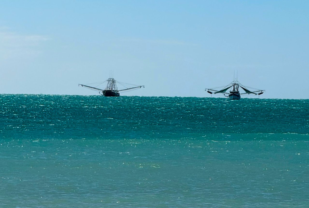 20 - Here's a close-up of the shrimpers we saw the day before.  They're hanging around out there for a day or two until the shrimping conditions improve, and then they'll go shrimp hunting with their huge nets.