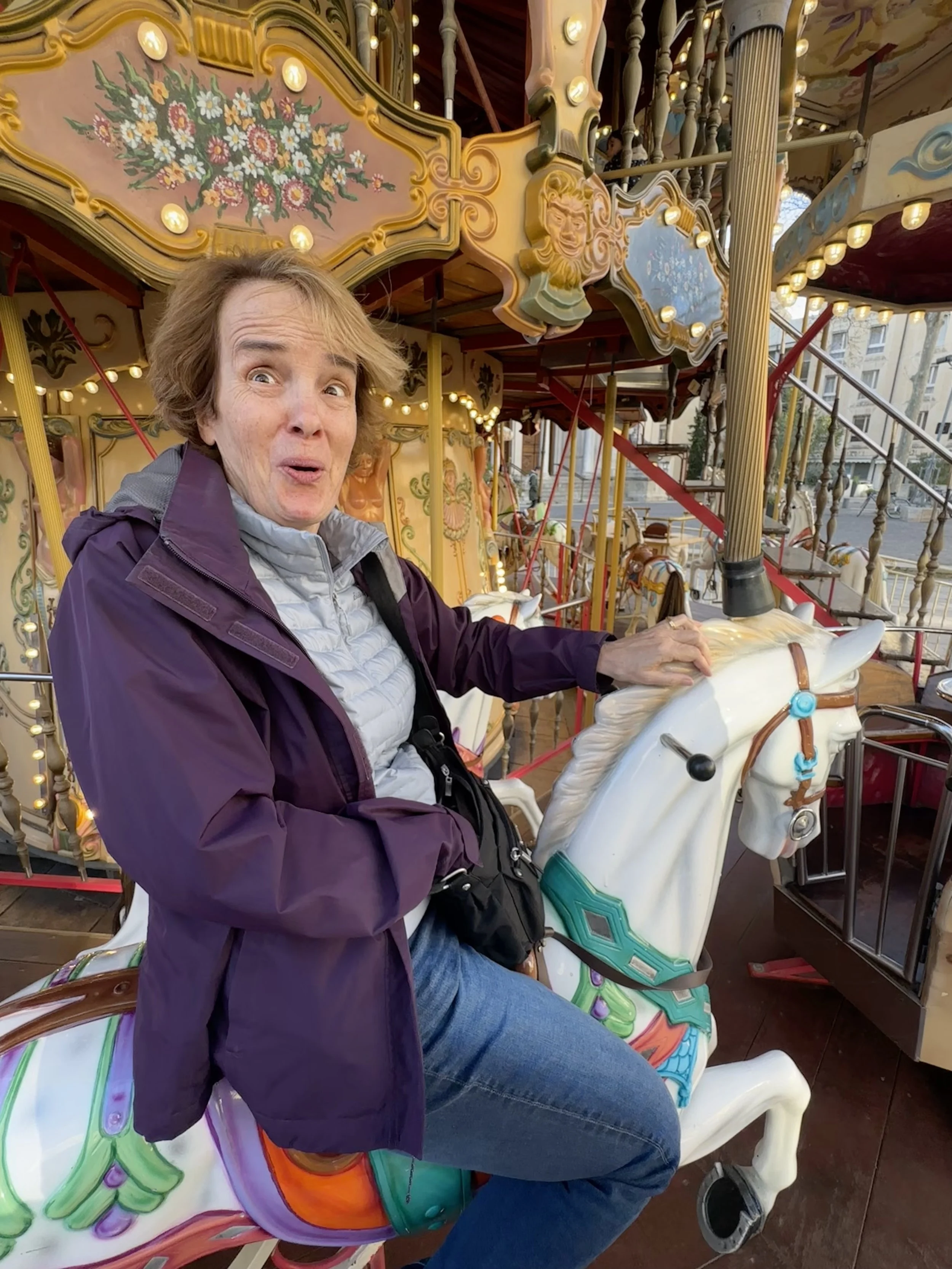 69 - Back in Avignon, at Place de l’Horloge, Julie finally gets to ride the Merry-Go-Round she'd been talking about for days.