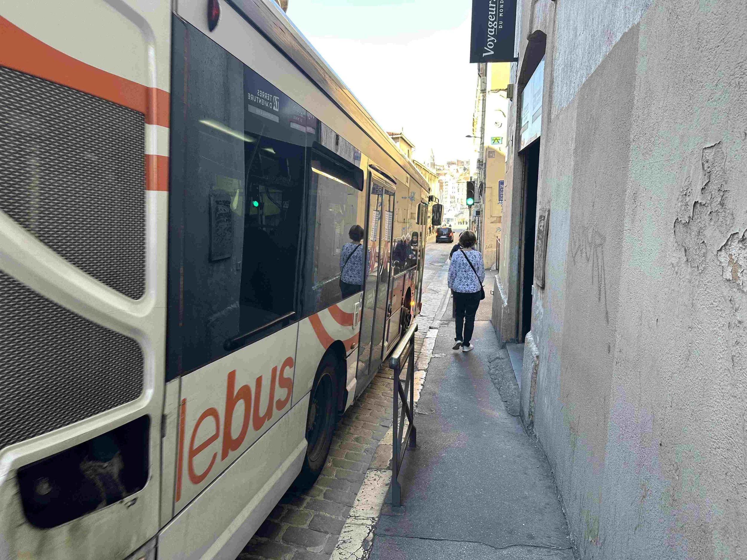 79 - On the way back to sea level, Julie demonstrates how crazy close traffic comes to pedestrians on many of the Marseille streets.  People cautioned us about crime in Marseille, but we thought the real danger was the traffic.