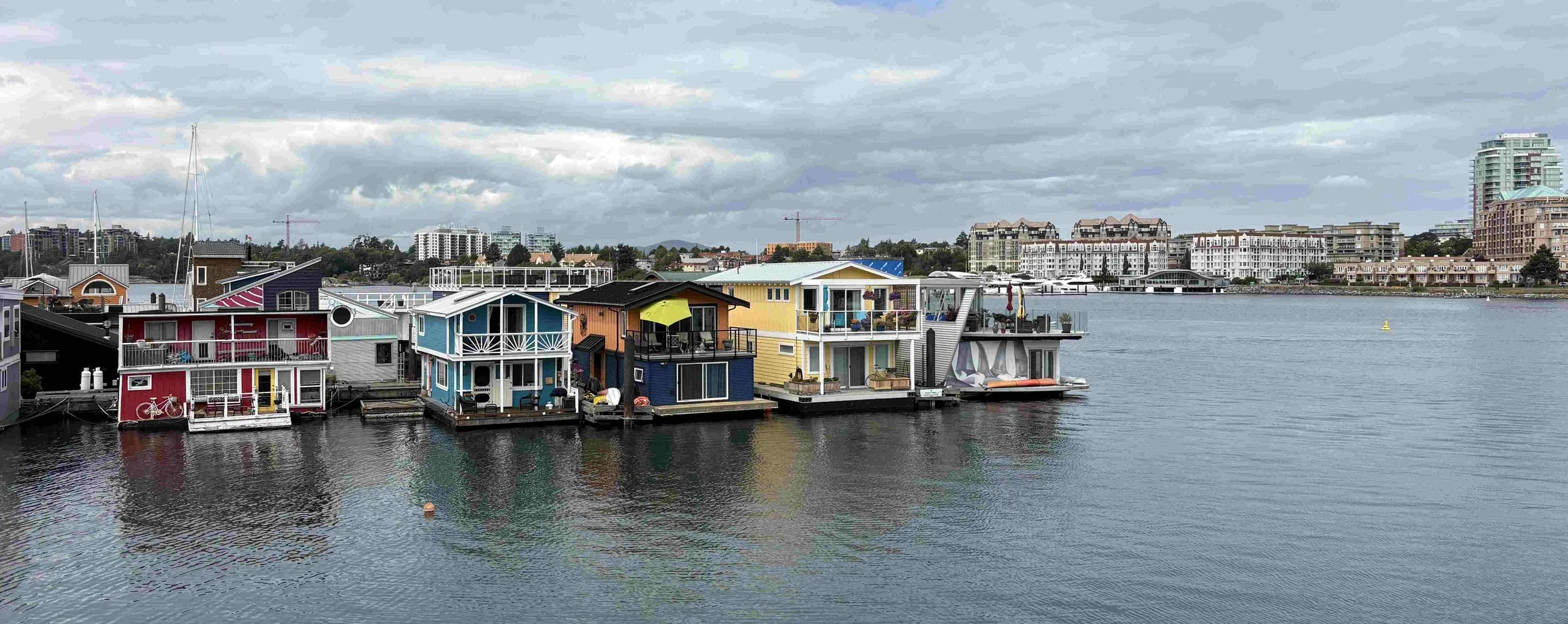 41 - Approaching Fisherman's Wharf, a colorful, vibrant floating village, known for its unique float homes, shops, and food kiosks. 