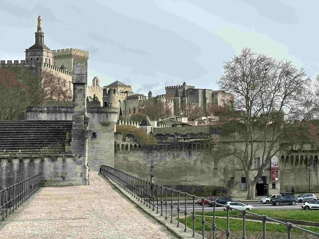 46 - From the bridge, this is a view of some of the City walls.  Avignon's city center is entirely enclosed by 2.5 miles of walls. The walls offer evidence of the importance of fortifications in 14th century France.

