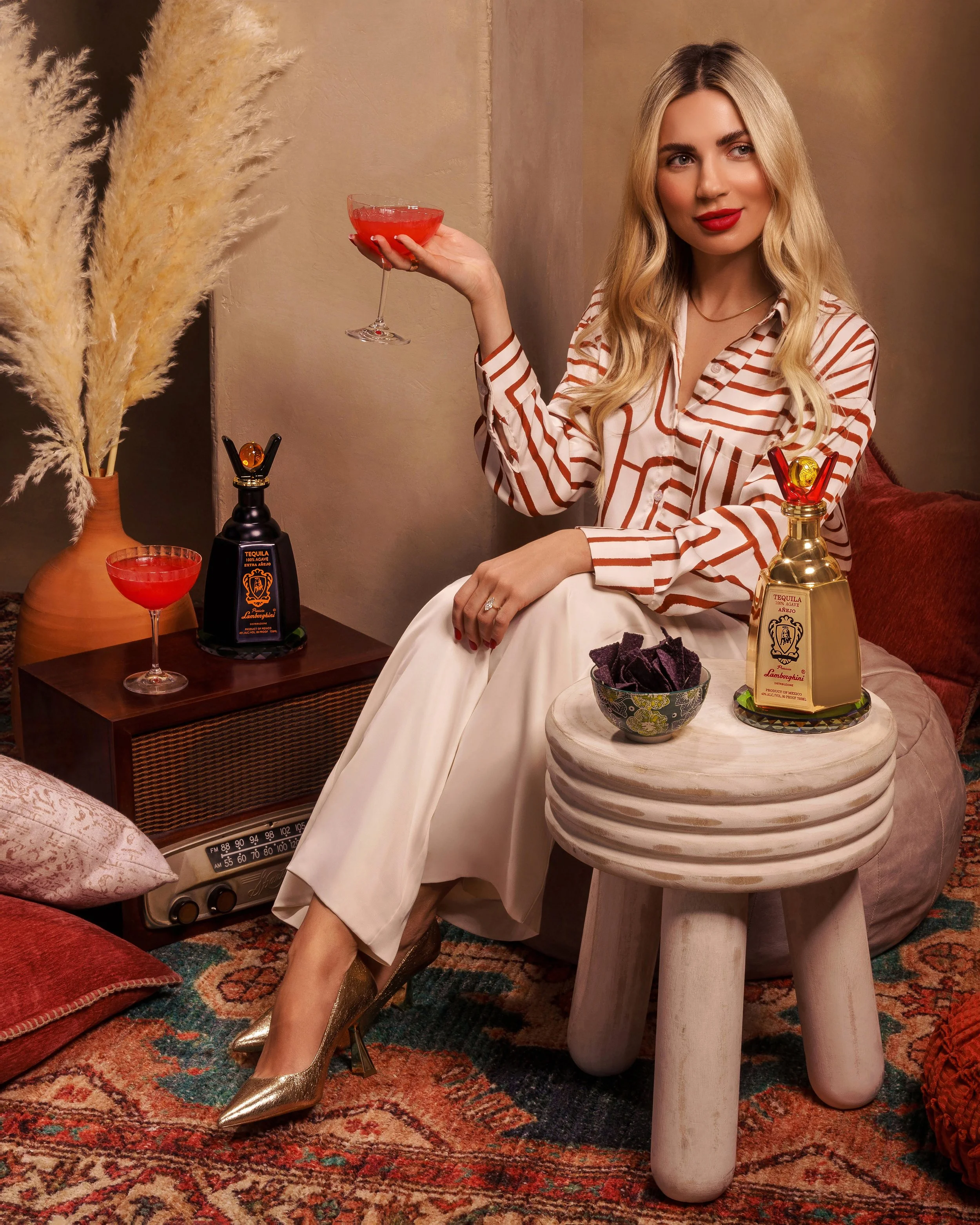 Lamborghini beverage tequila campaign with model posing with drinks boho setup and decor