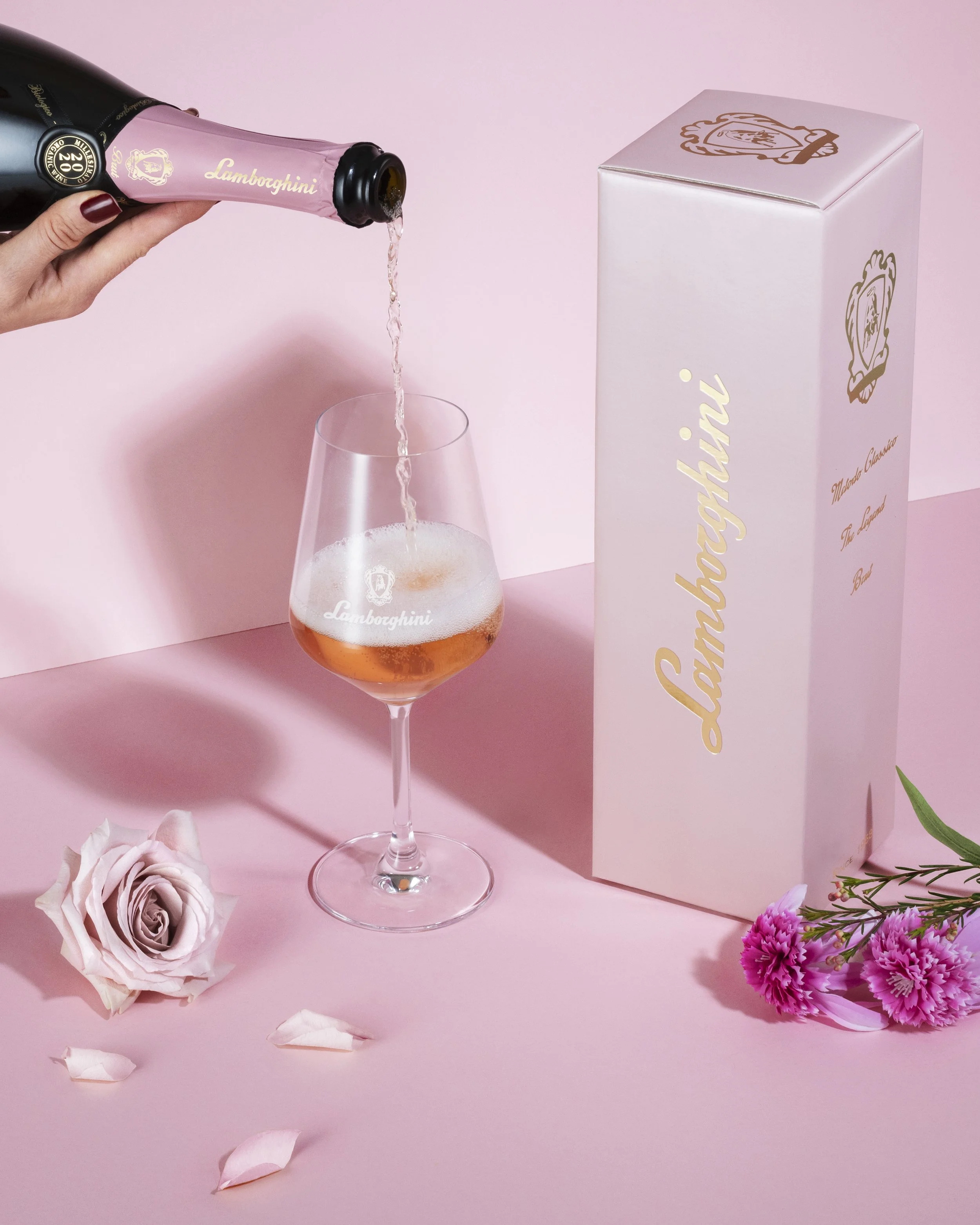 Pink Lamborghini wine Valentine's Day celebration photoshoot for Lamborghini luxury campaign