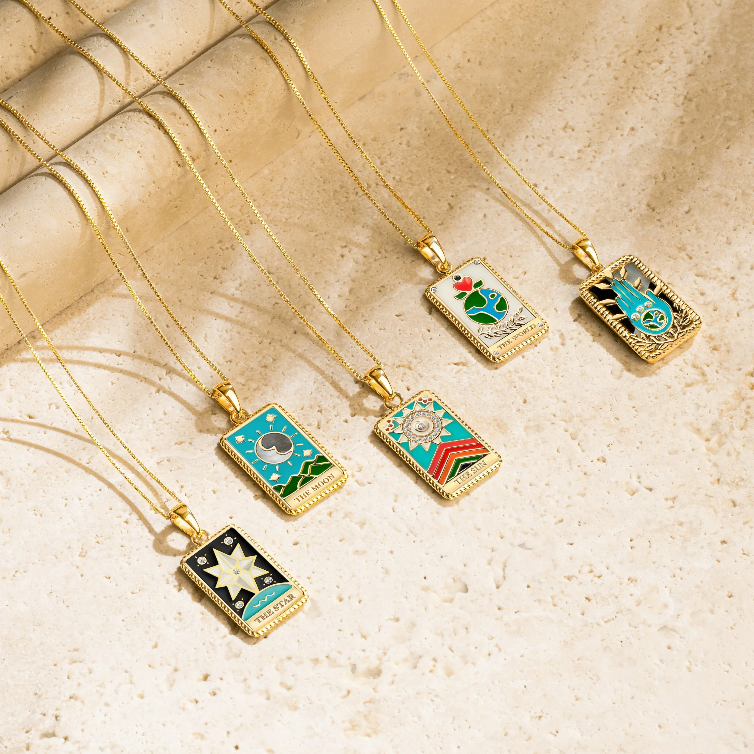 Tarot necklaces displayed on natural stone by Juan Zabala photography