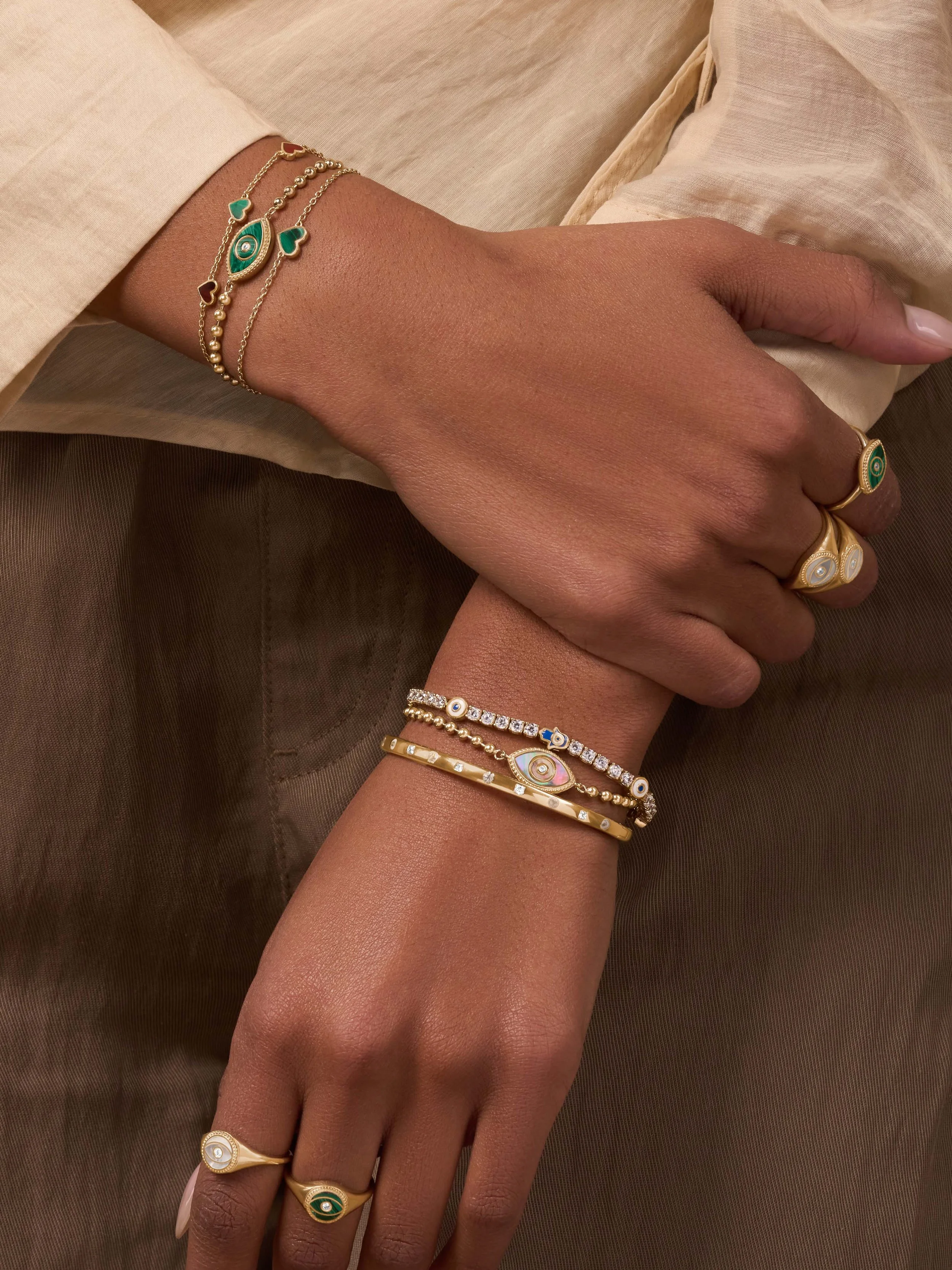 Jewelry photography for Karma and Luck of up close hands with jewelry