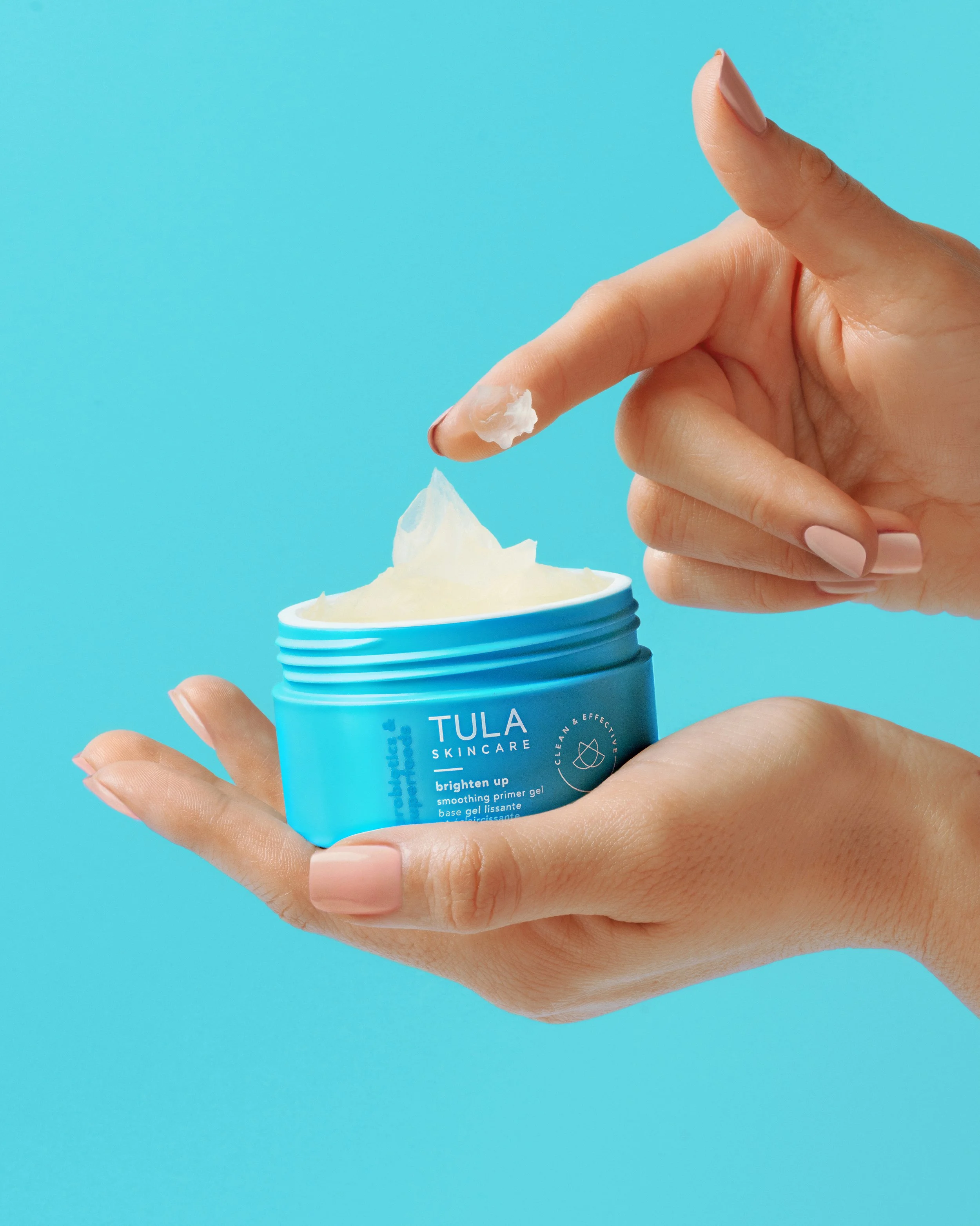 Hand displaying Tula brands beauty cream