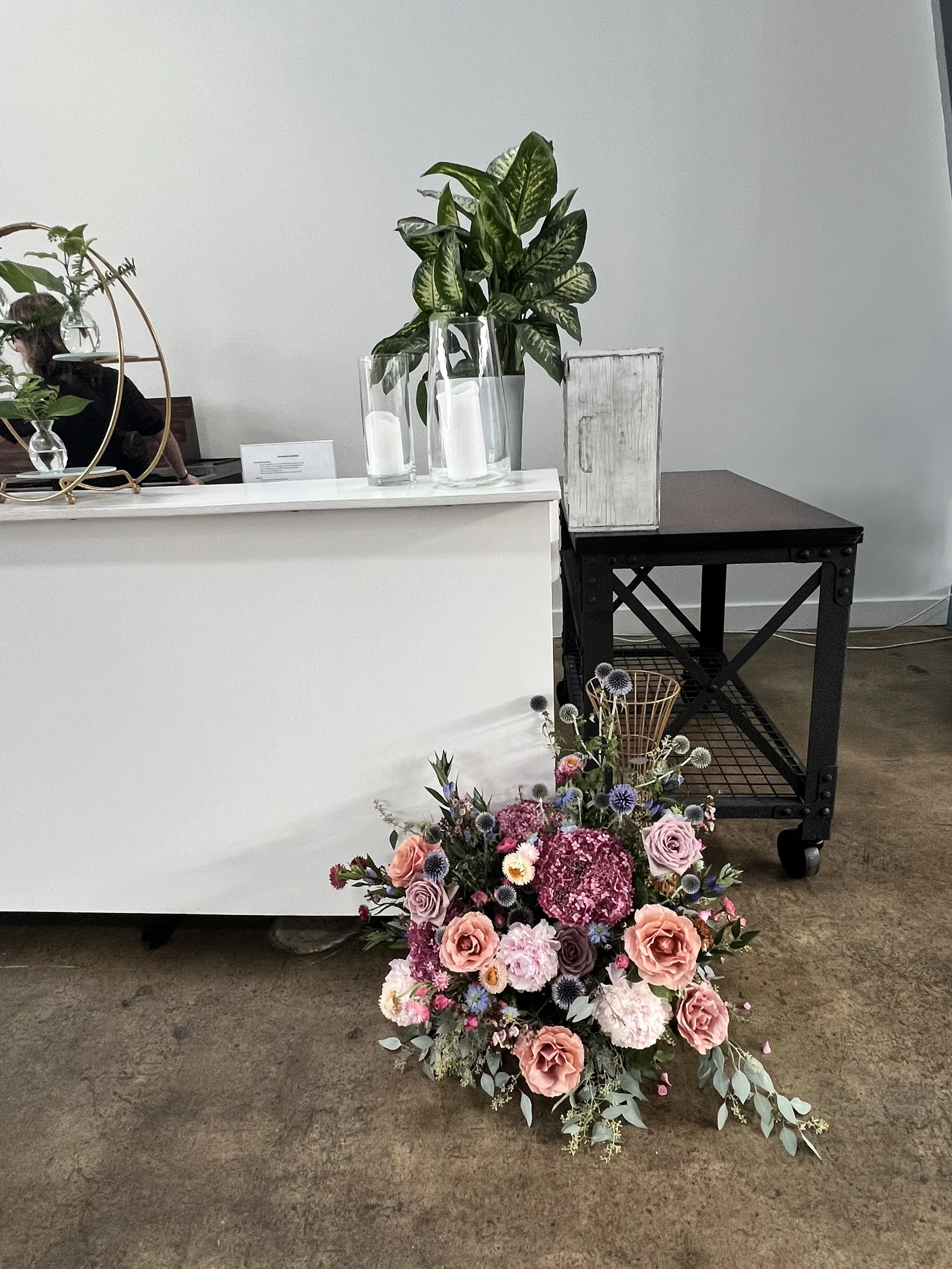 Pink, Rose, Purple and Coral florals in a large arrangement for bar decor