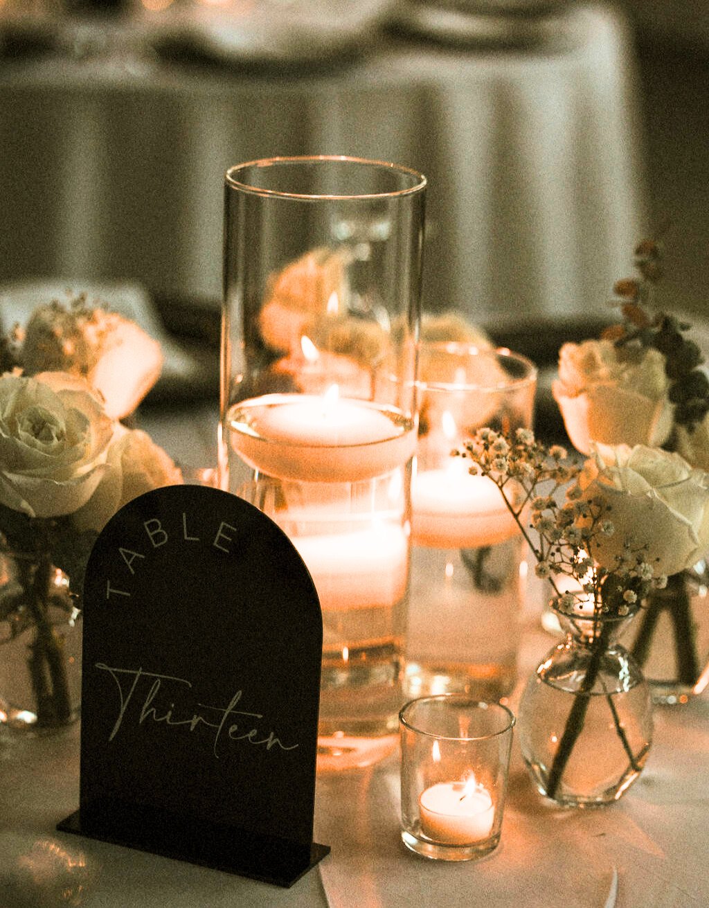 Floating candle and floral package for guest tables.