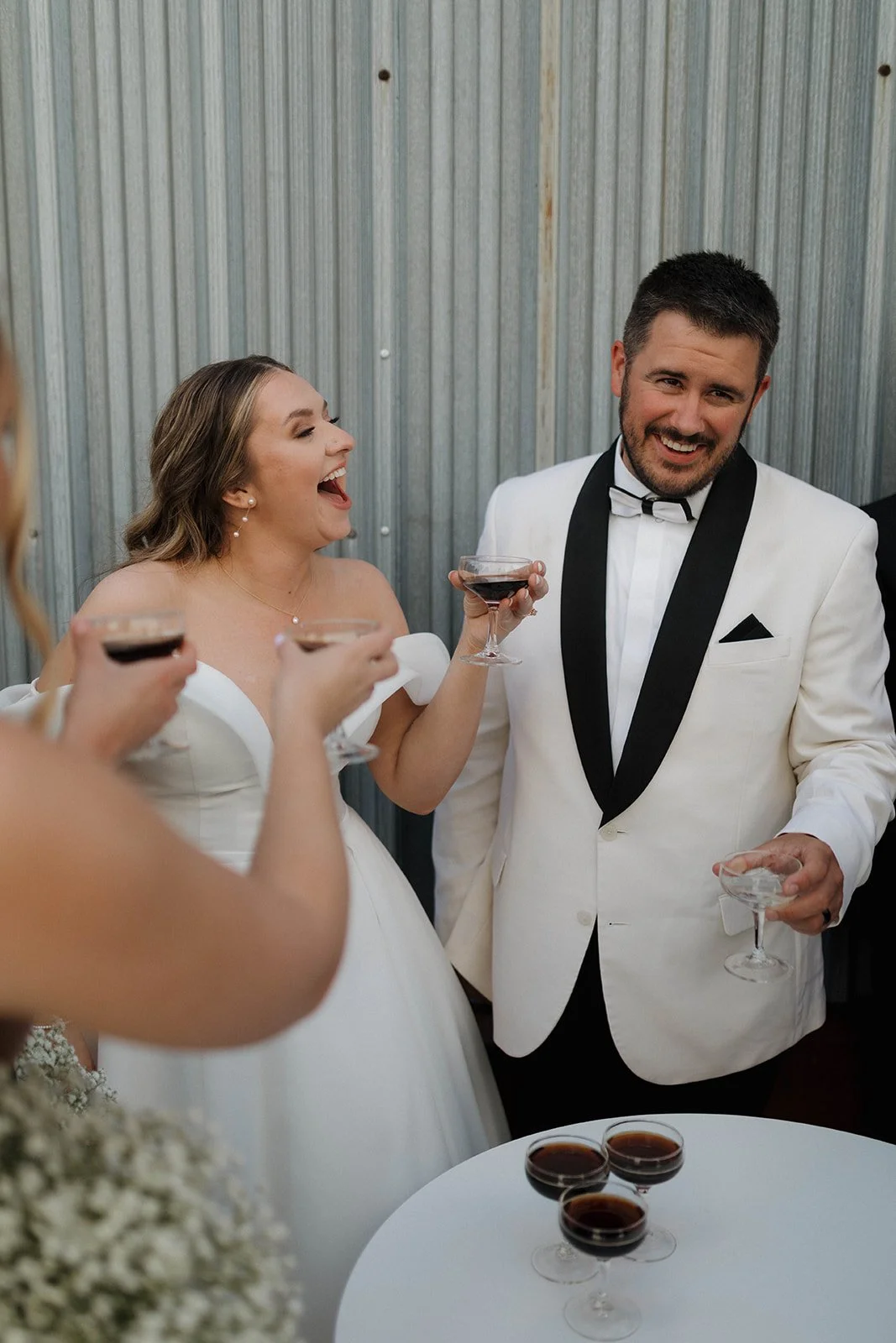 Bride and Groom and Wedding party doing a post-ceremony toast on the patio with espresso martinis!