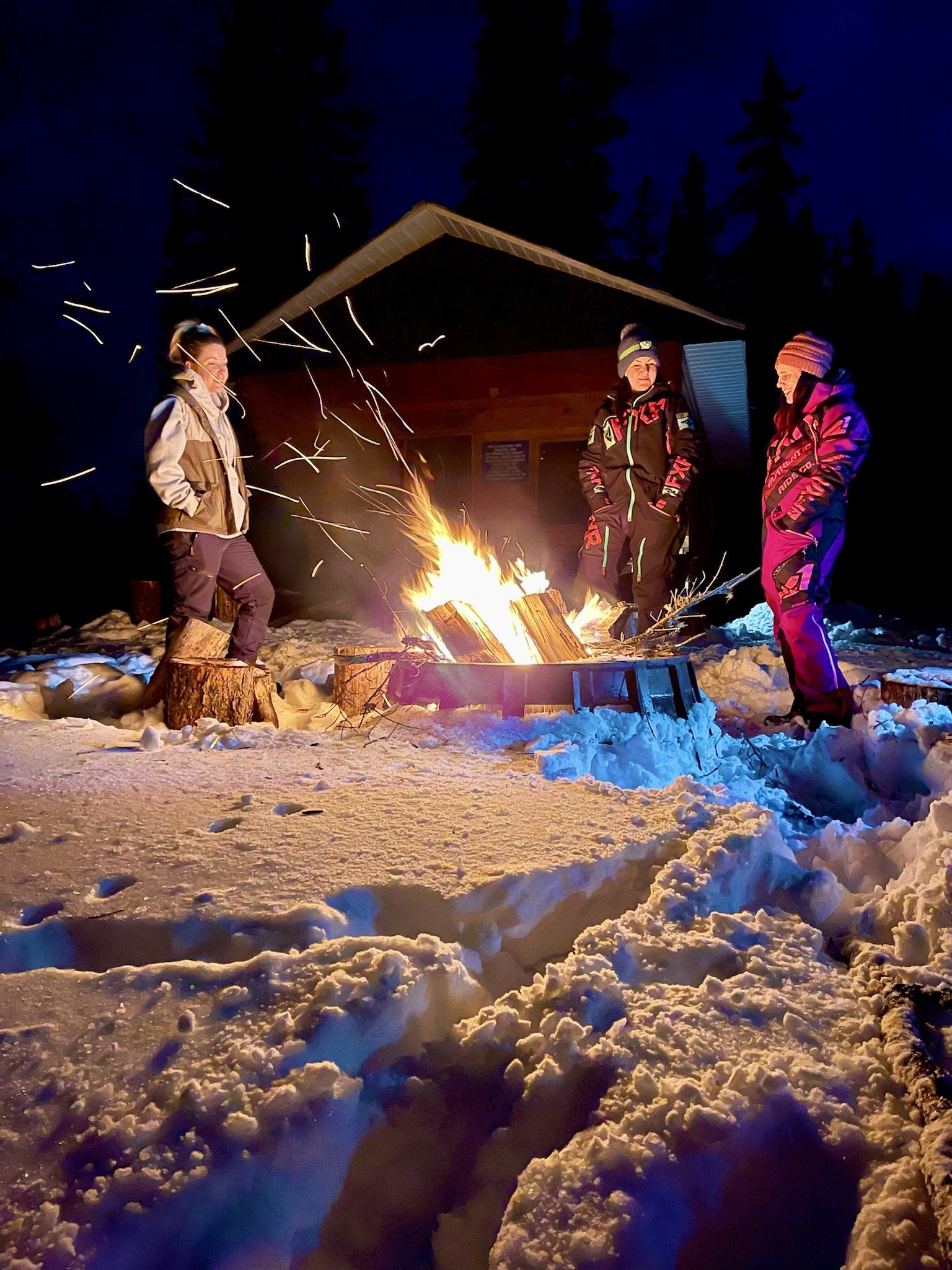 Lost Haven Cabin bonfire at night in the winter - Photo credit Jessie Olsen