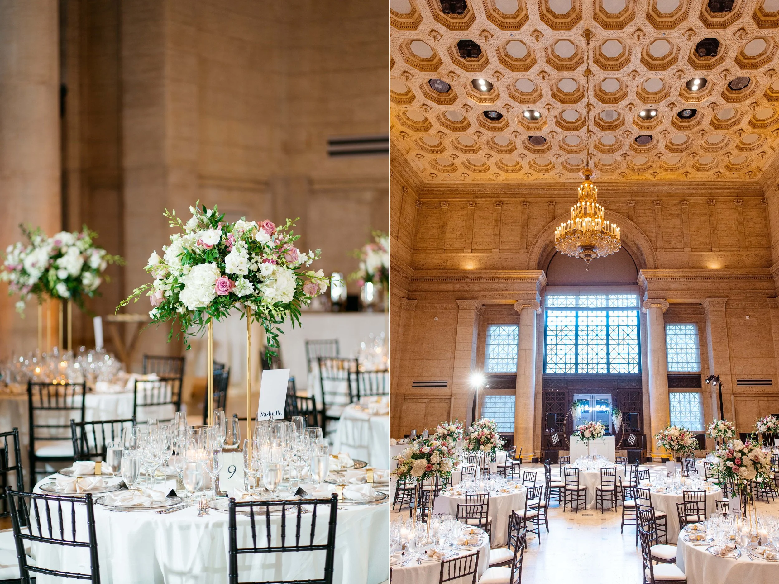A large banquet hall set up for a wedding or formal event, with multiple round tables adorned with white tablecloths and tall floral centerpieces featuring pink and white flowers. The hall has high, ornate ceilings with a grand chandelier, large wind