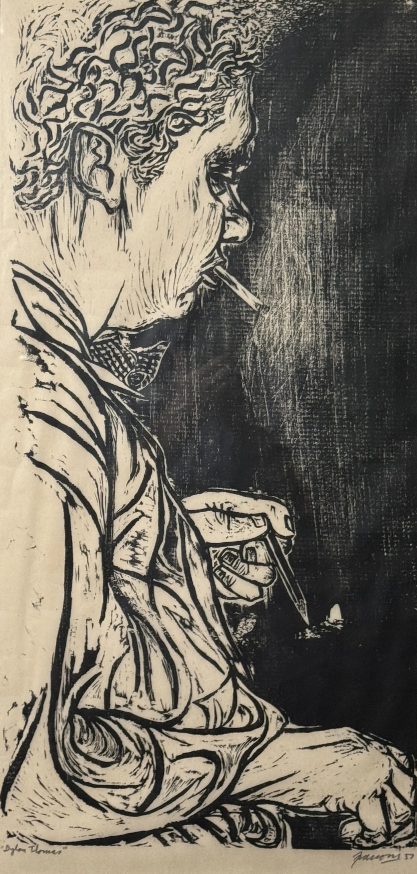 A black and white artistic ink drawing of a man with curly hair, smoking a cigarette, sitting and writing with a pen.