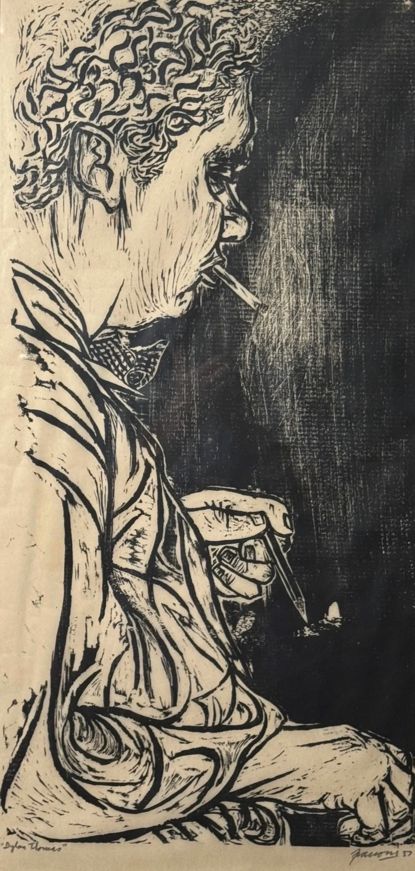 Woodcut print by Antonio Frasconi of portrait of the poet Dylan Thomas, smoking a cigarette, and holding a pen or pencil, sitting with a notebook or paper in his lap.
