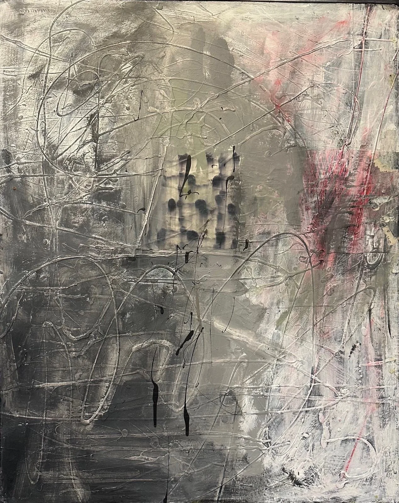 Abstract painting with layered gray, black, white, pink, and green textures, featuring a faint impression of a human face or figure in the center.