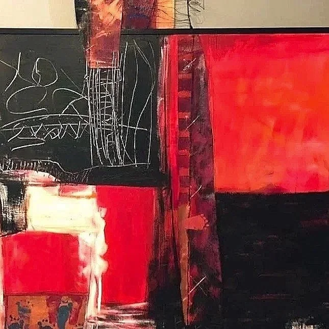 Abstract painting with bold red, black, white, and hints of orange colors, featuring layered rectangular shapes and scribbled white lines.