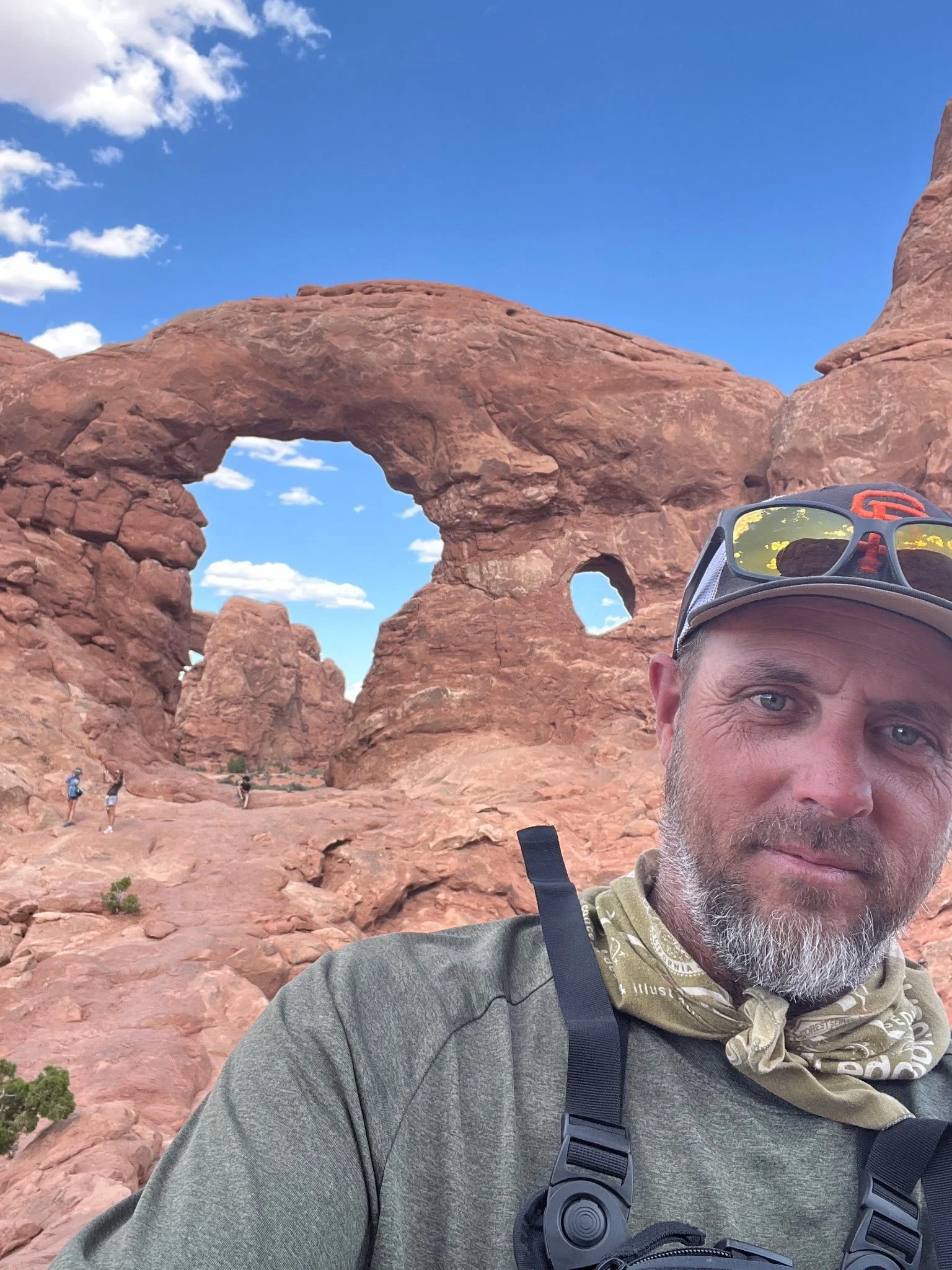 Man in front of arches at Arches National Park