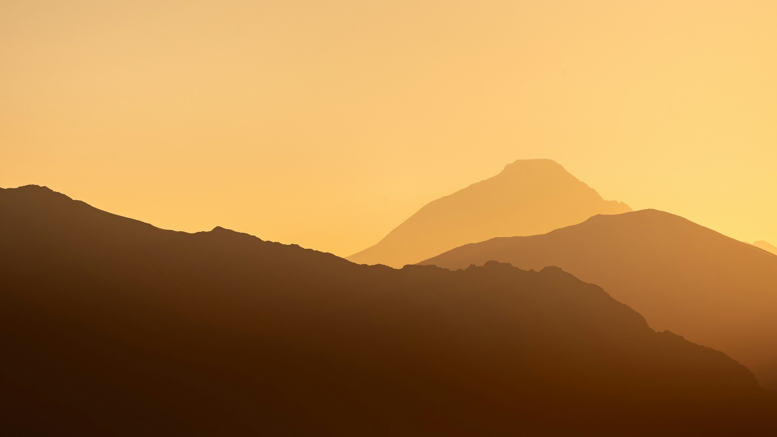 yellow lit mountains