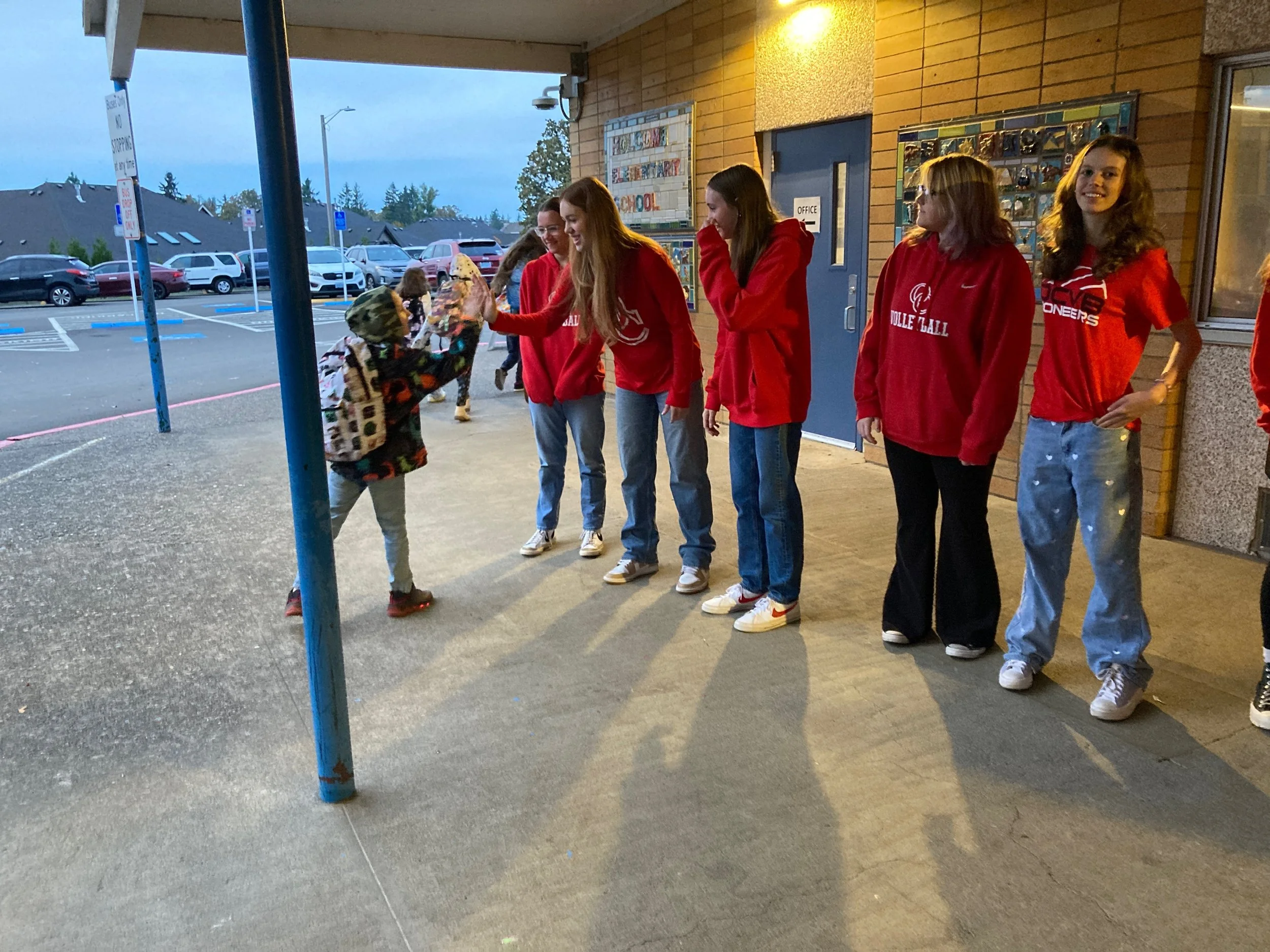 OC VB players greet students — Elementary School
