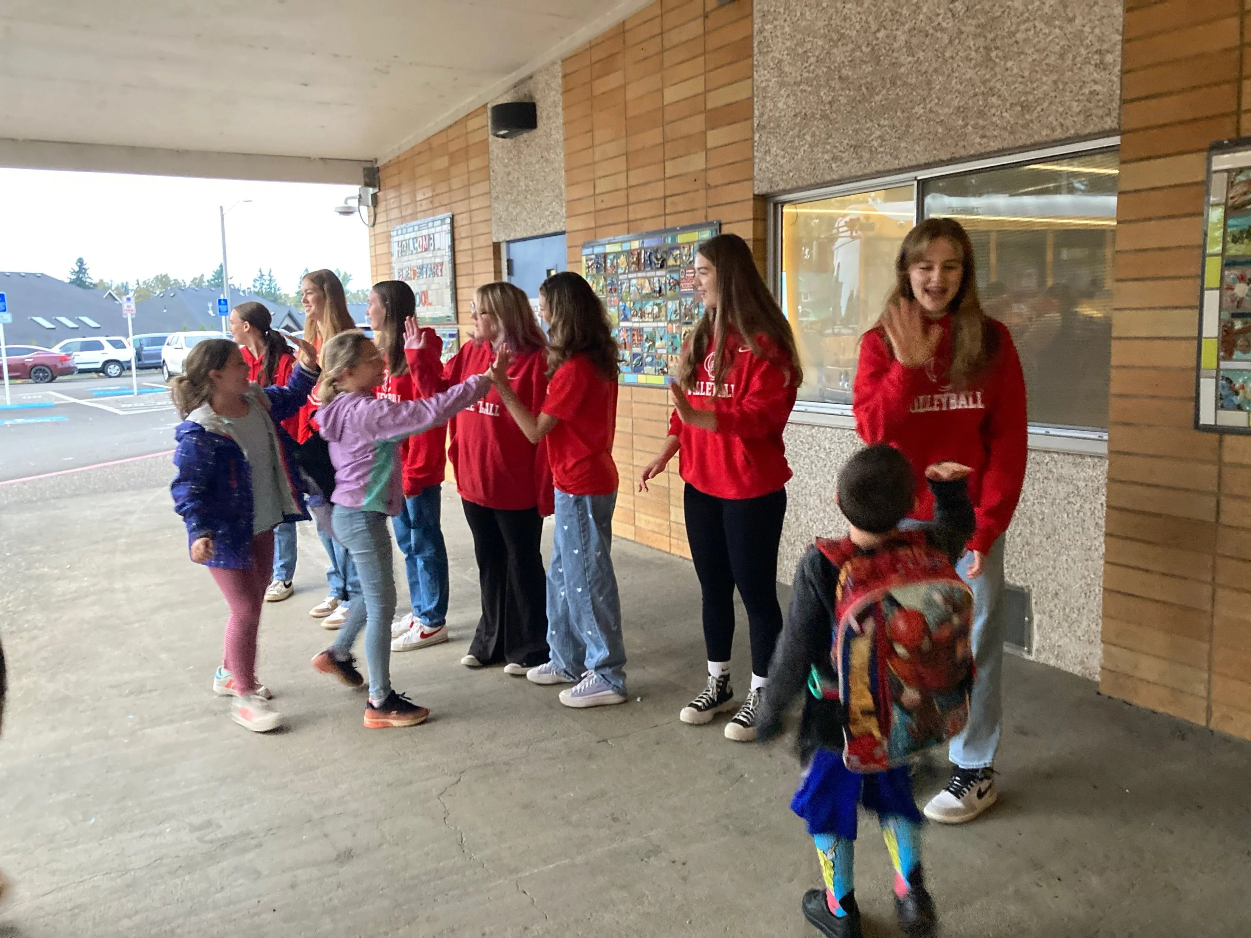 OC VB players greet students — Elementary School