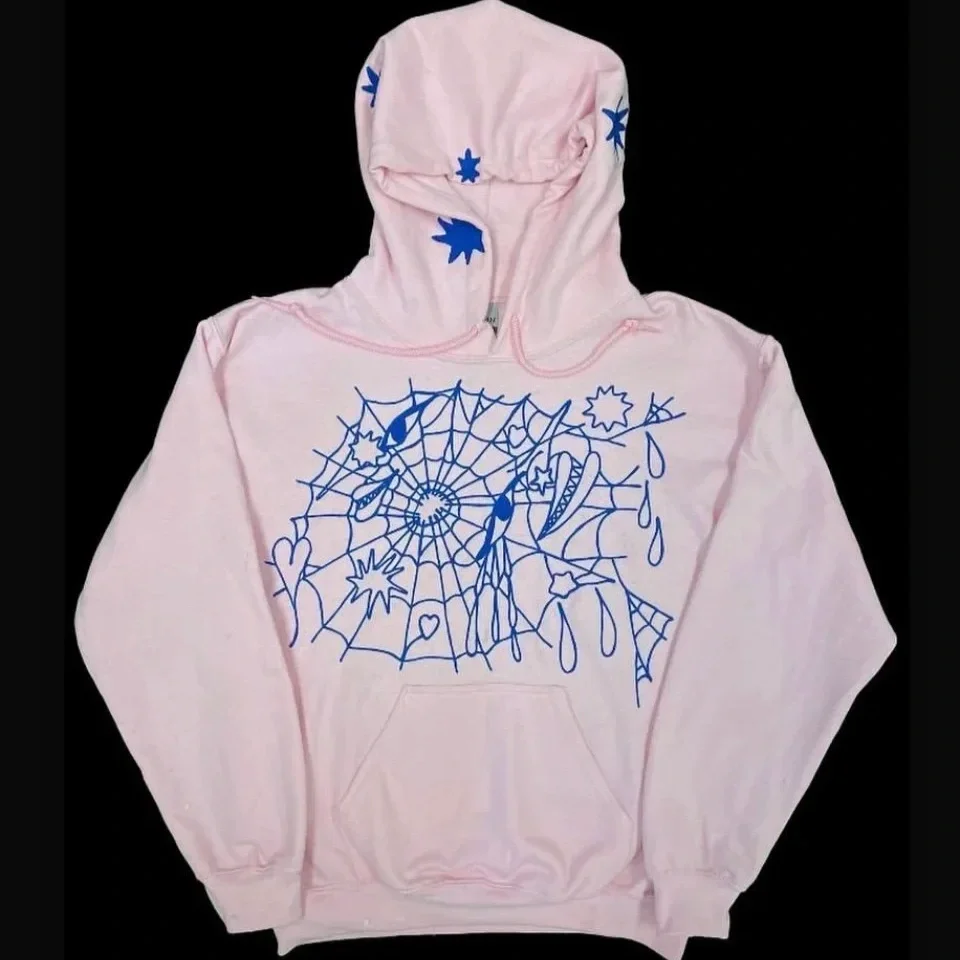 A light pink hoodie with a blue graphic design of a spider web, spiders, and various abstract shapes on the front and hood.