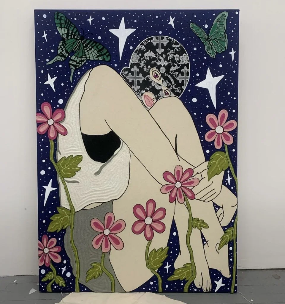 A colorful painting of a person with a mask, sitting with knees pulled up, surrounded by pink flowers, green vines, butterflies, stars, and a moon in a starry night sky.