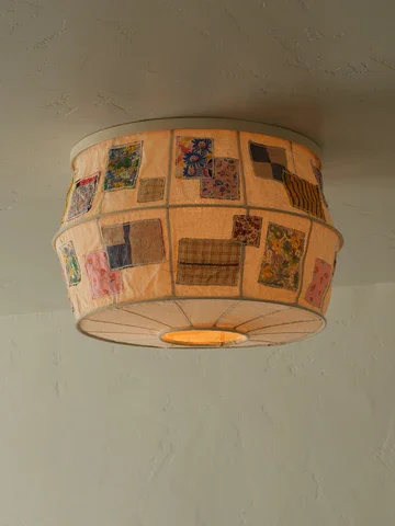 Ceiling light fixture with a patchwork quilt design.