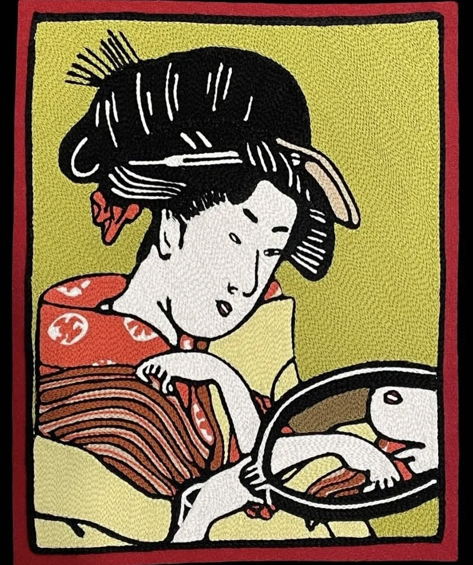 A young woman with traditional Japanese hairstyle and red kimono, looking at her reflection in a mirror, with a yellow background and red border.