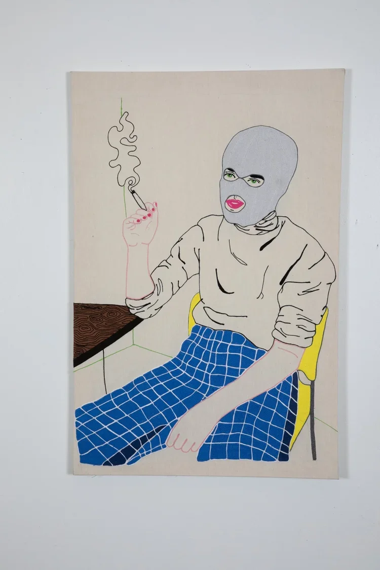 Line drawing of a person sitting on a yellow chair, wearing a gray ski mask, green eyes, pink lipstick, and a beige sweatshirt. They are holding a lit cigarette, with smoke rising, and are wearing blue checkered pants. The person is seated next to a 
