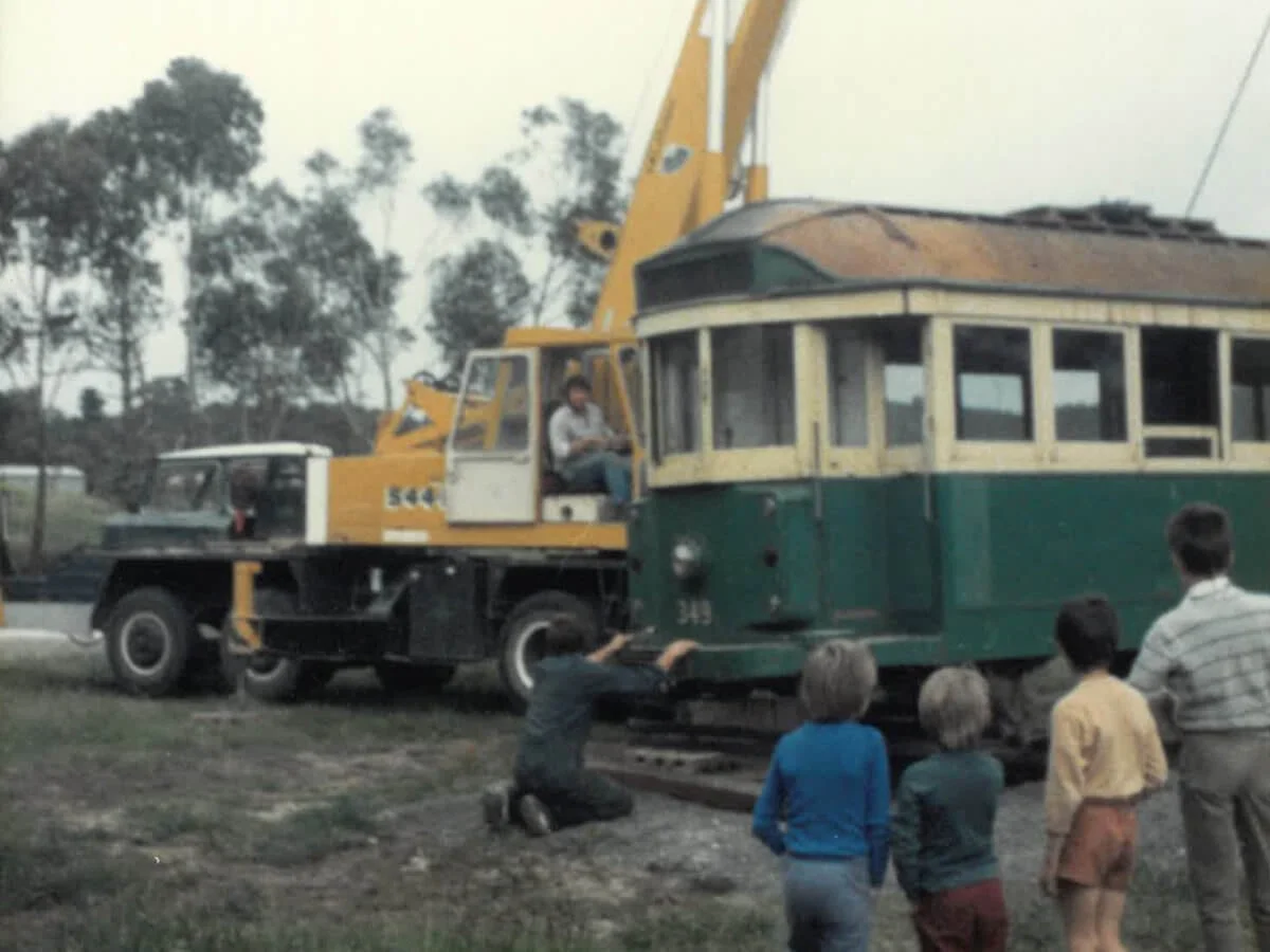 old tram being lifted at Village School
