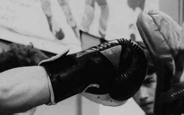 Boxing Gloves hitting a pad