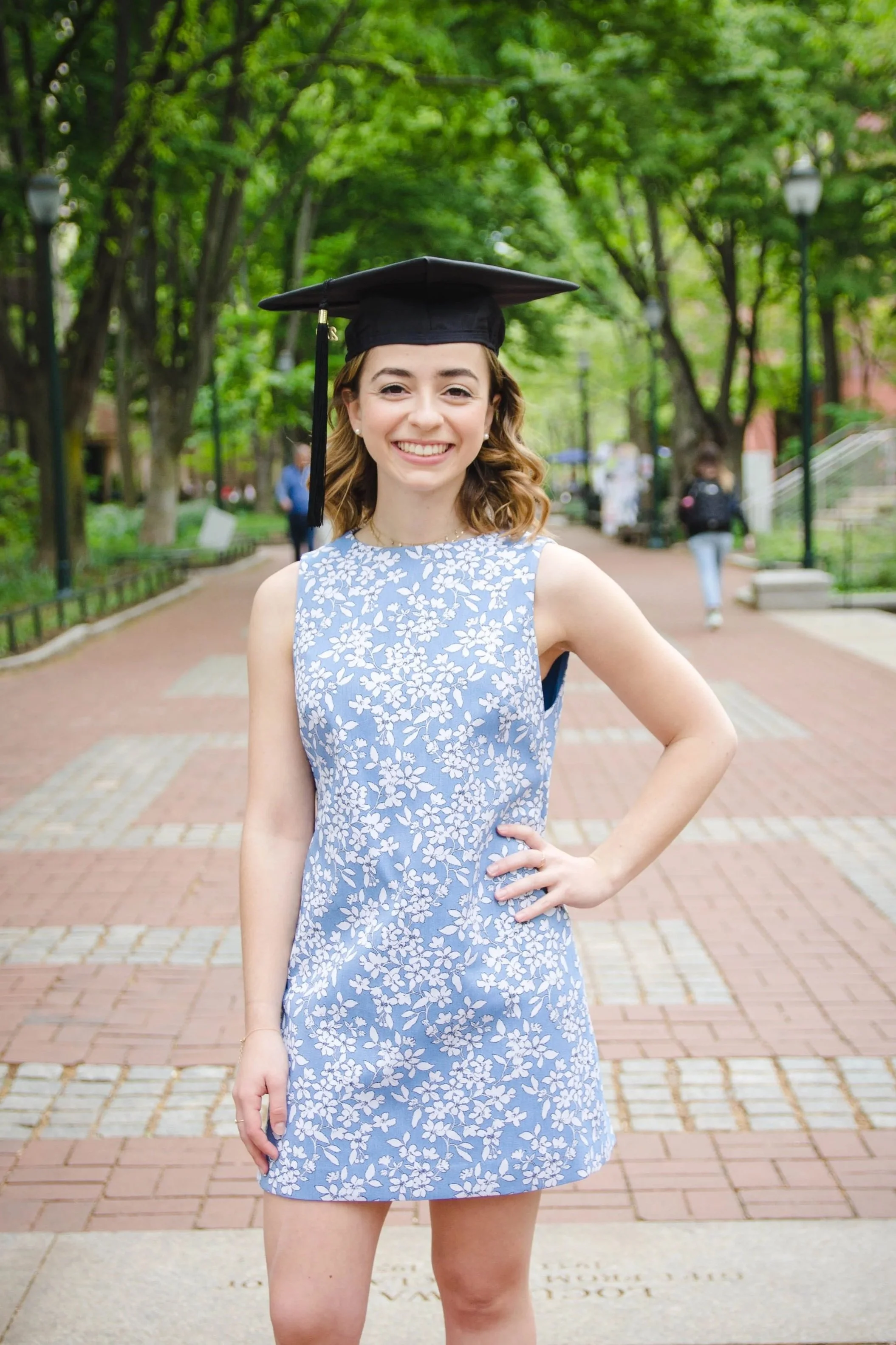 Senior college portrait of a woman wearing a graduation cap at University of Pennsylvania