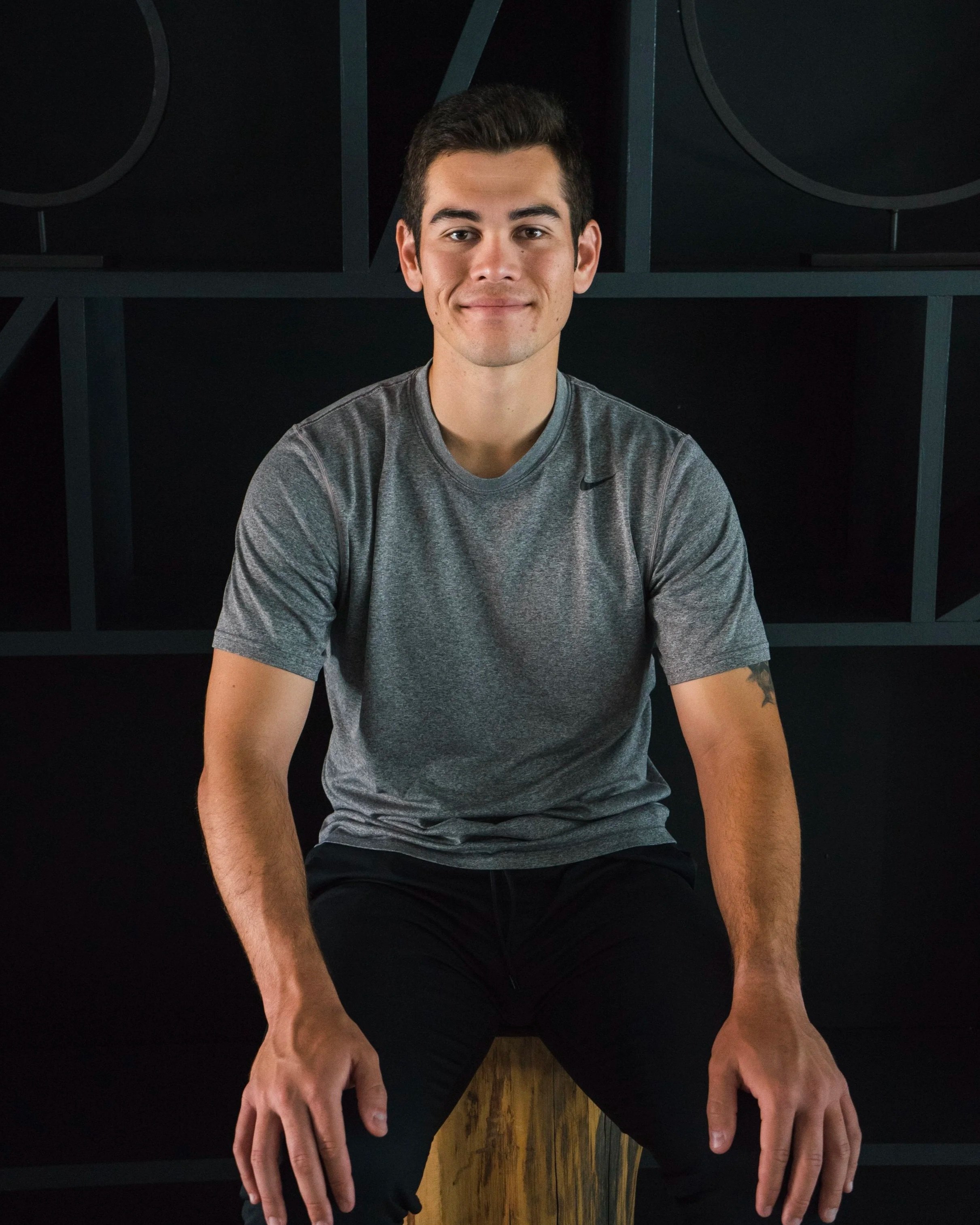 Fitness headshot of a male athlete trainer in a modern gym