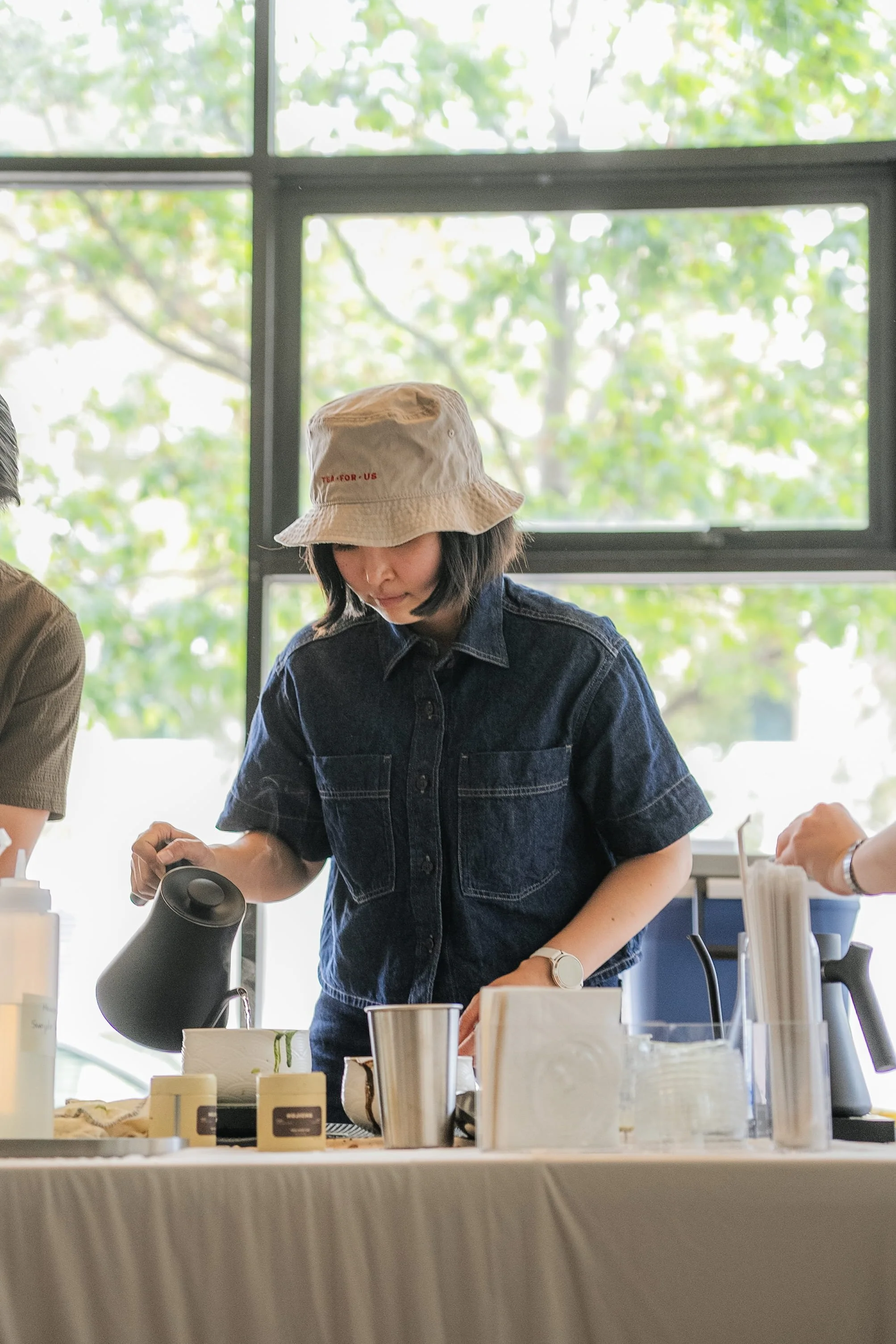 Brand owner making matcha drinks during a Tea For Us brand activation pop-up with Kindred Studio in San Francisco