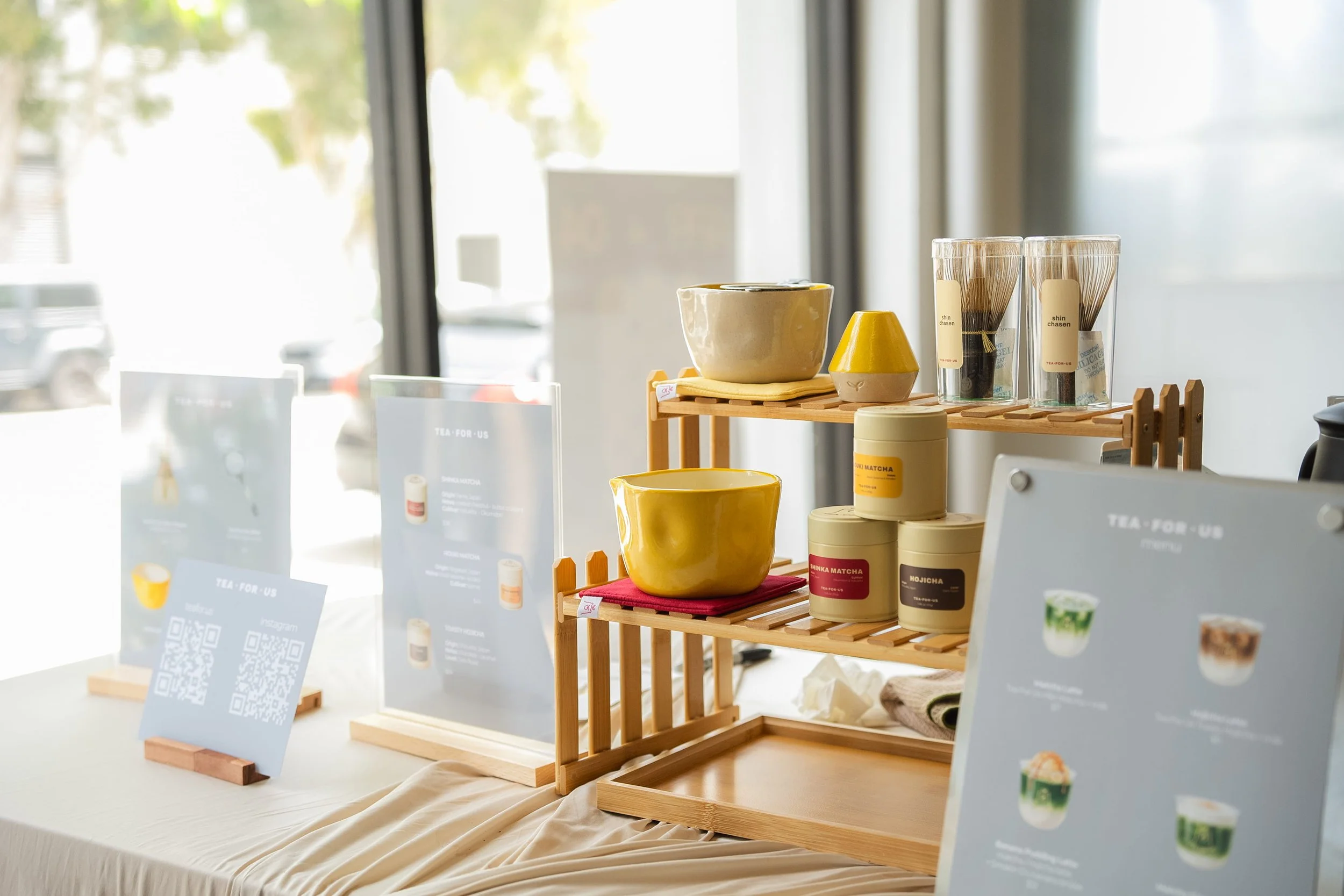 Product shot of handmade ceramics, matcha tins, and chasens for sale during a Tea For Us brand activation pop-up with Kindred Studio in San Francisco