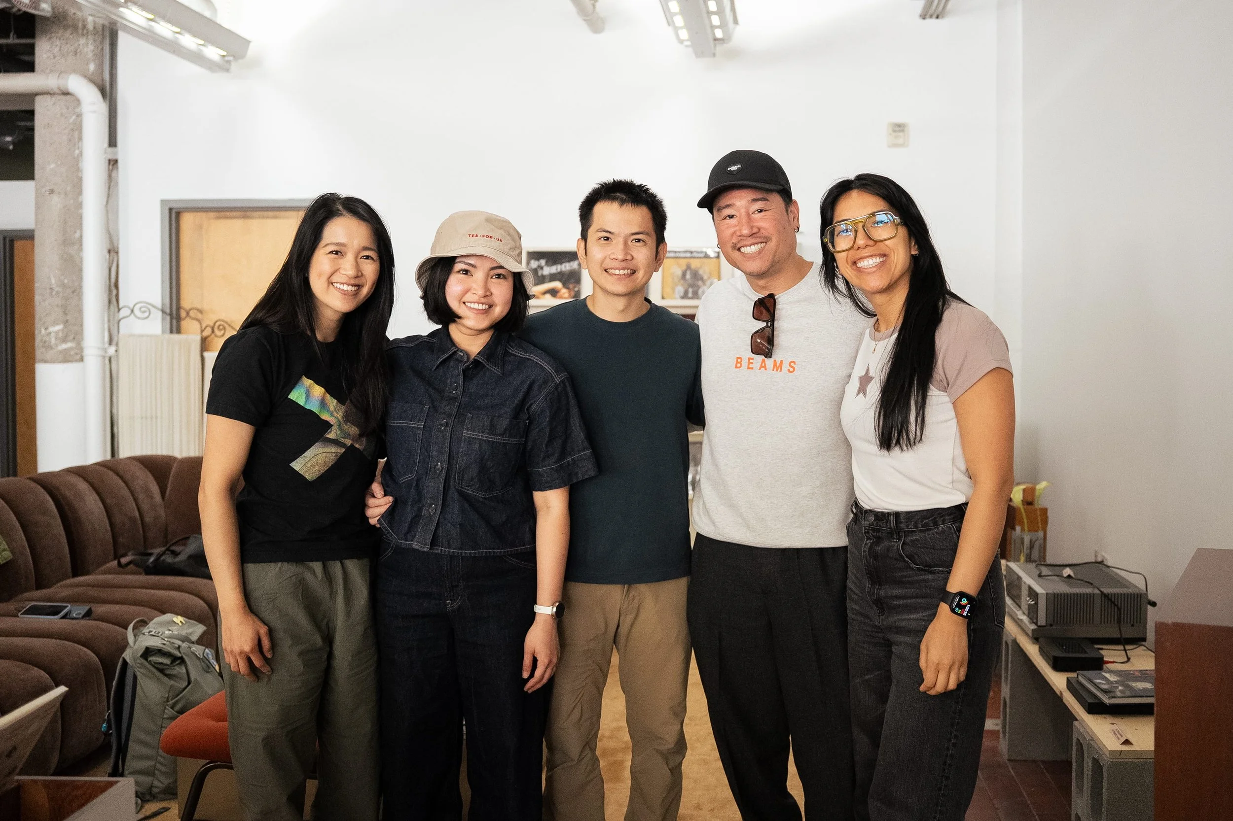 Group photo of brand owner with friends and family during a Tea For Us brand activation pop-up with Kindred Studio in San Francisco