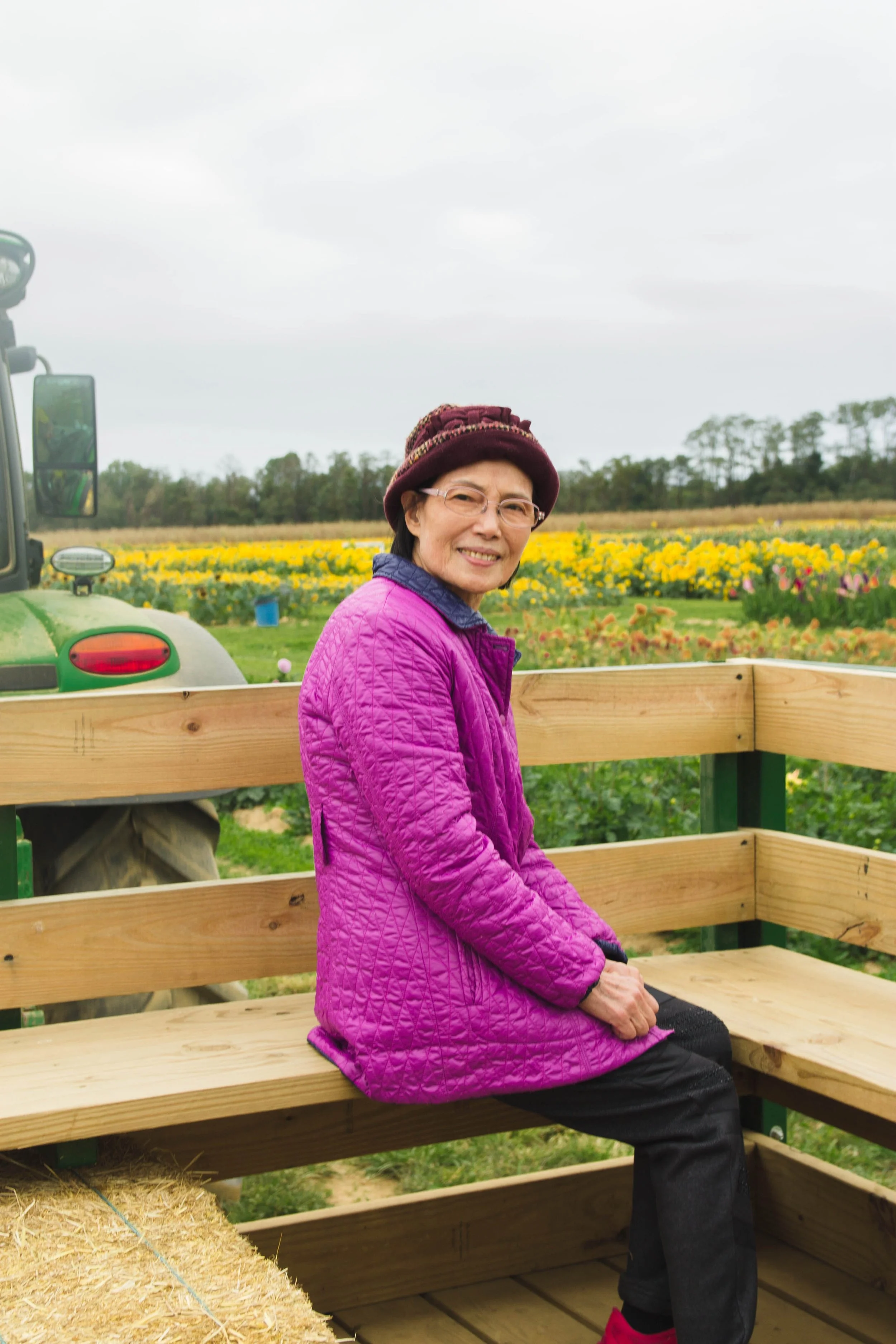 Candid portrait of a Chinese grandmother on a sunflower farm
